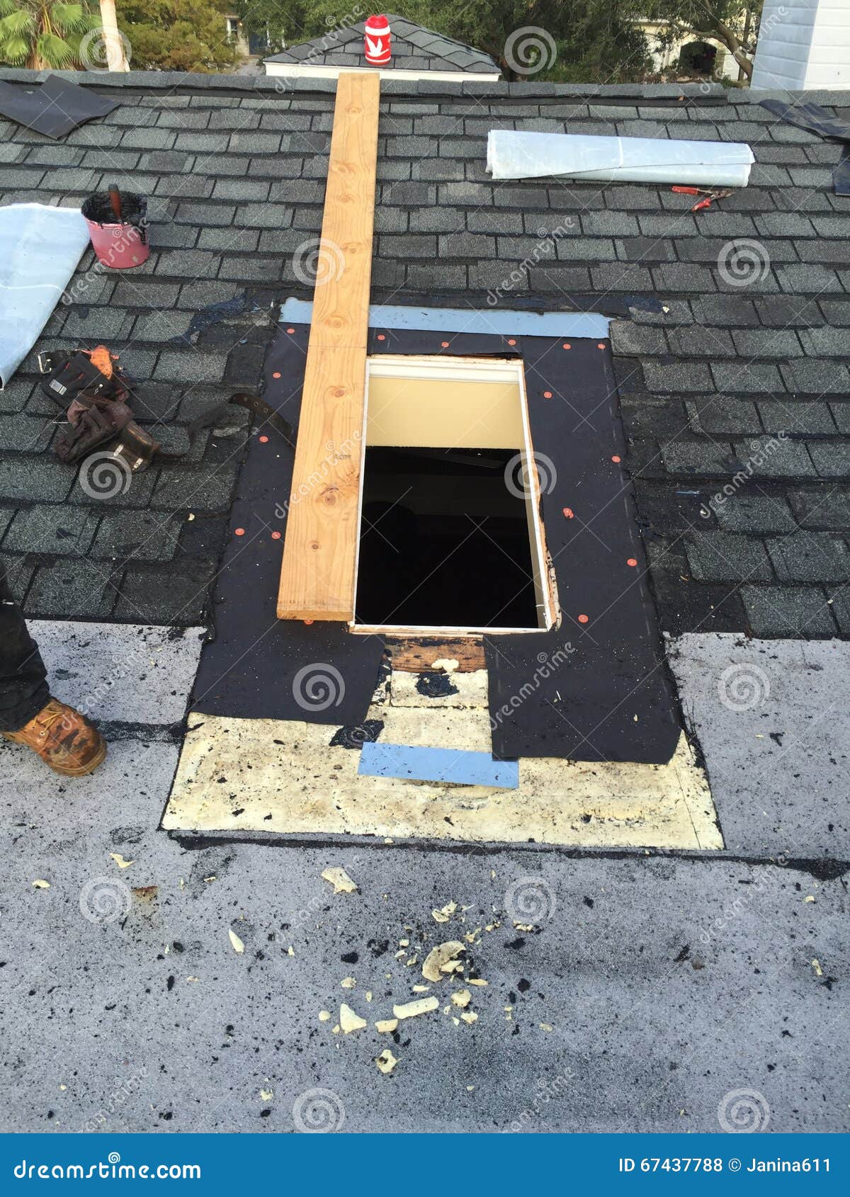 Shingle Roof and Skylight Repairs in Process, Roofer, Tools Stock Photo