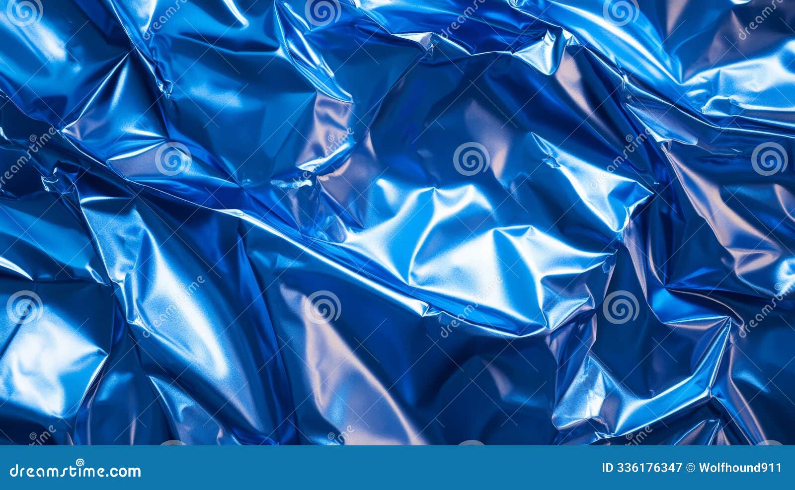 a shiny blue plastic poster with multiple creases and crumples. the deep folds create dynamic