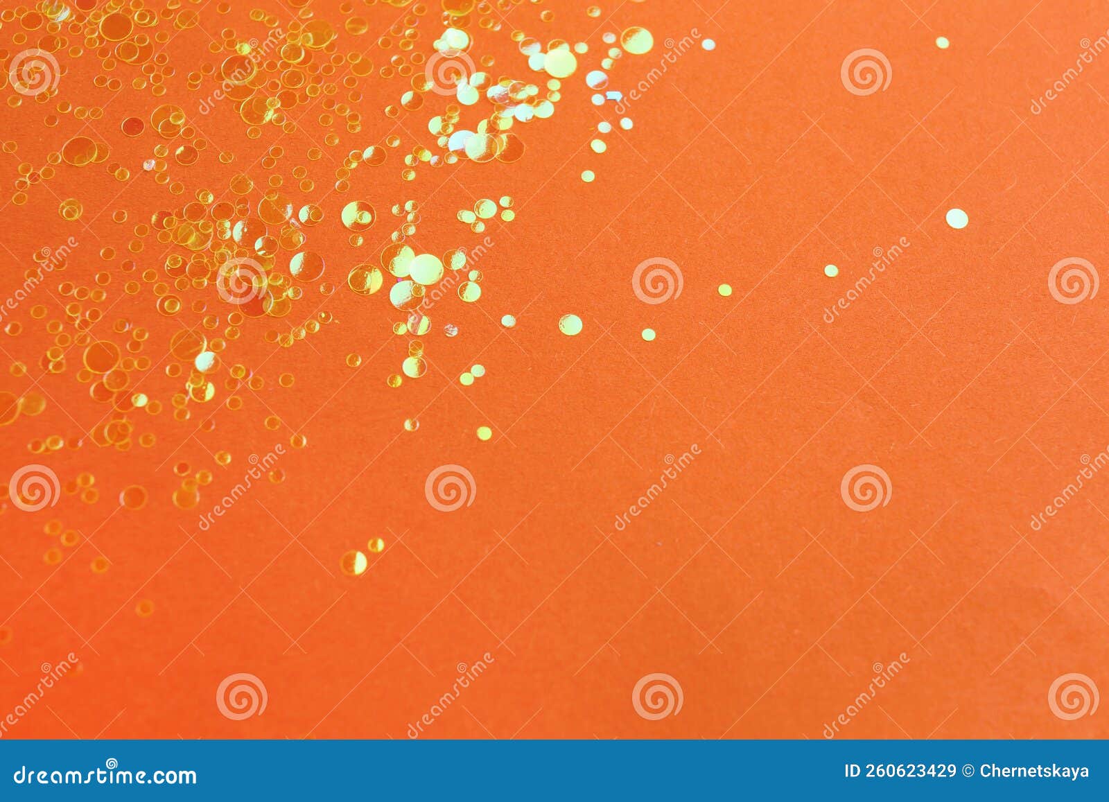 Shiny Bright Golden Glitter on Orange Background. Space for Text Stock