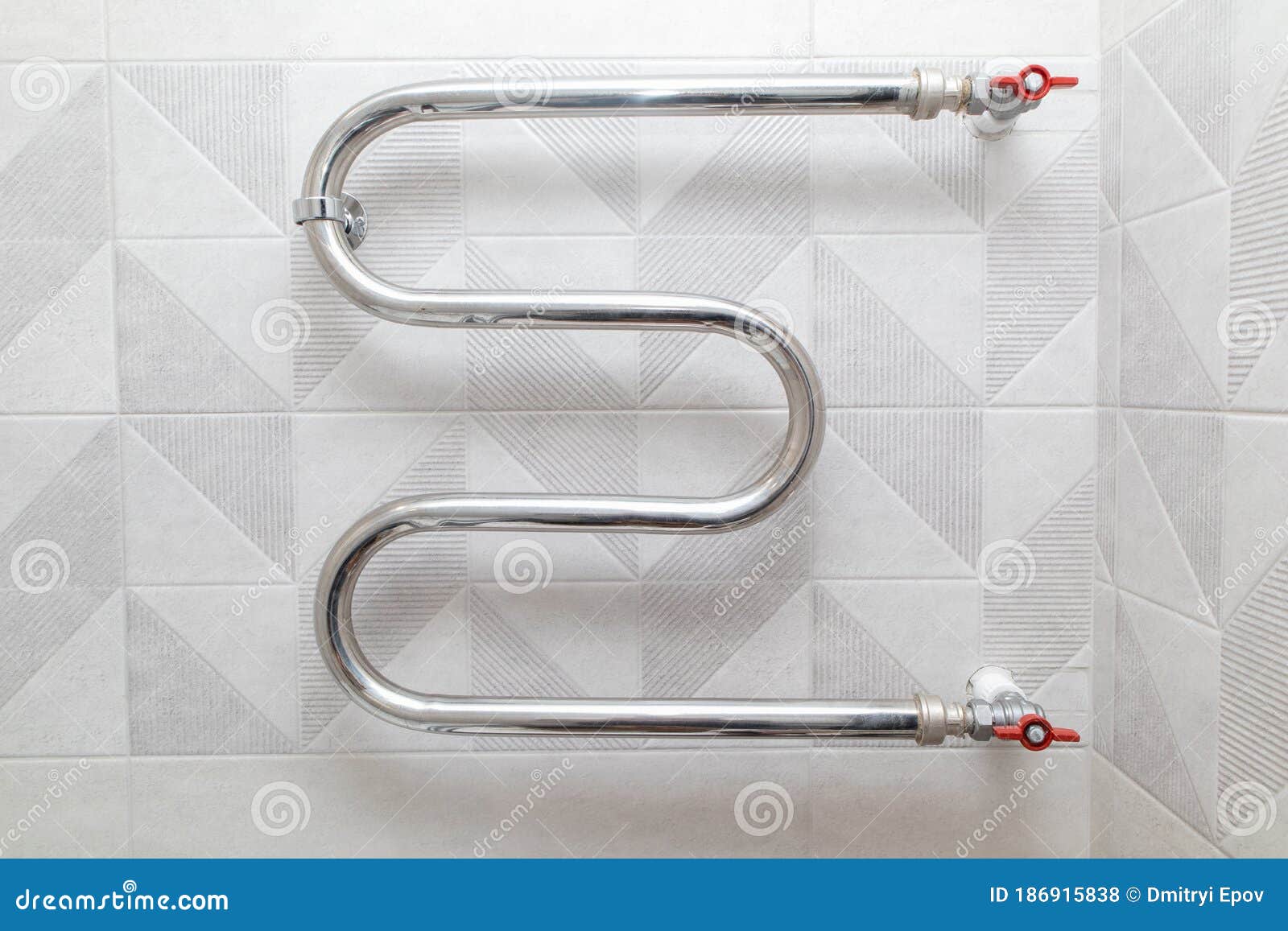 shiny metal heated towel rail set in the bathroom