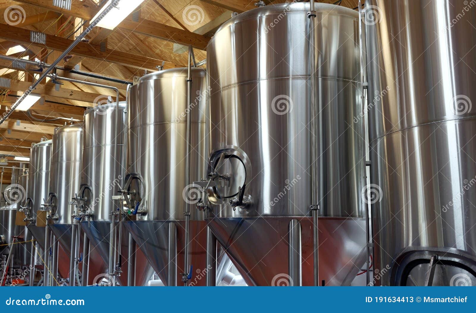 shiny metal micro brewery tanks