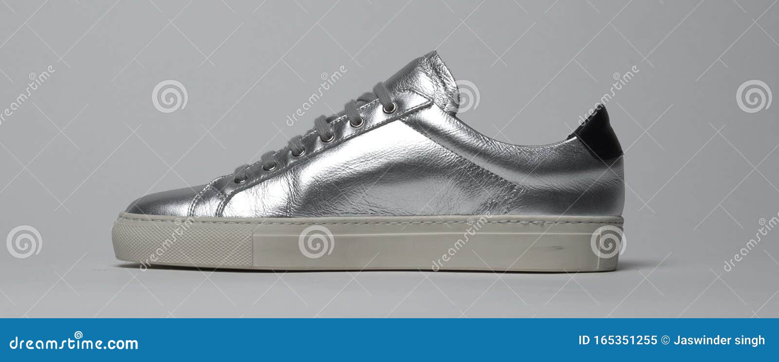 Shiny Silver Colored Sneakers with White Base and White Background ...