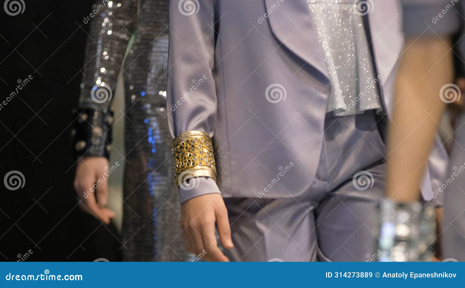 shiny wristband on model podium defile show. female vogue fashion runway.