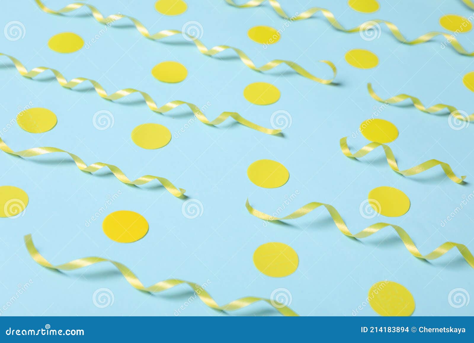 Shiny Yellow Serpentine Streamers and Confetti on Light Blue Background Stock Photo Image of