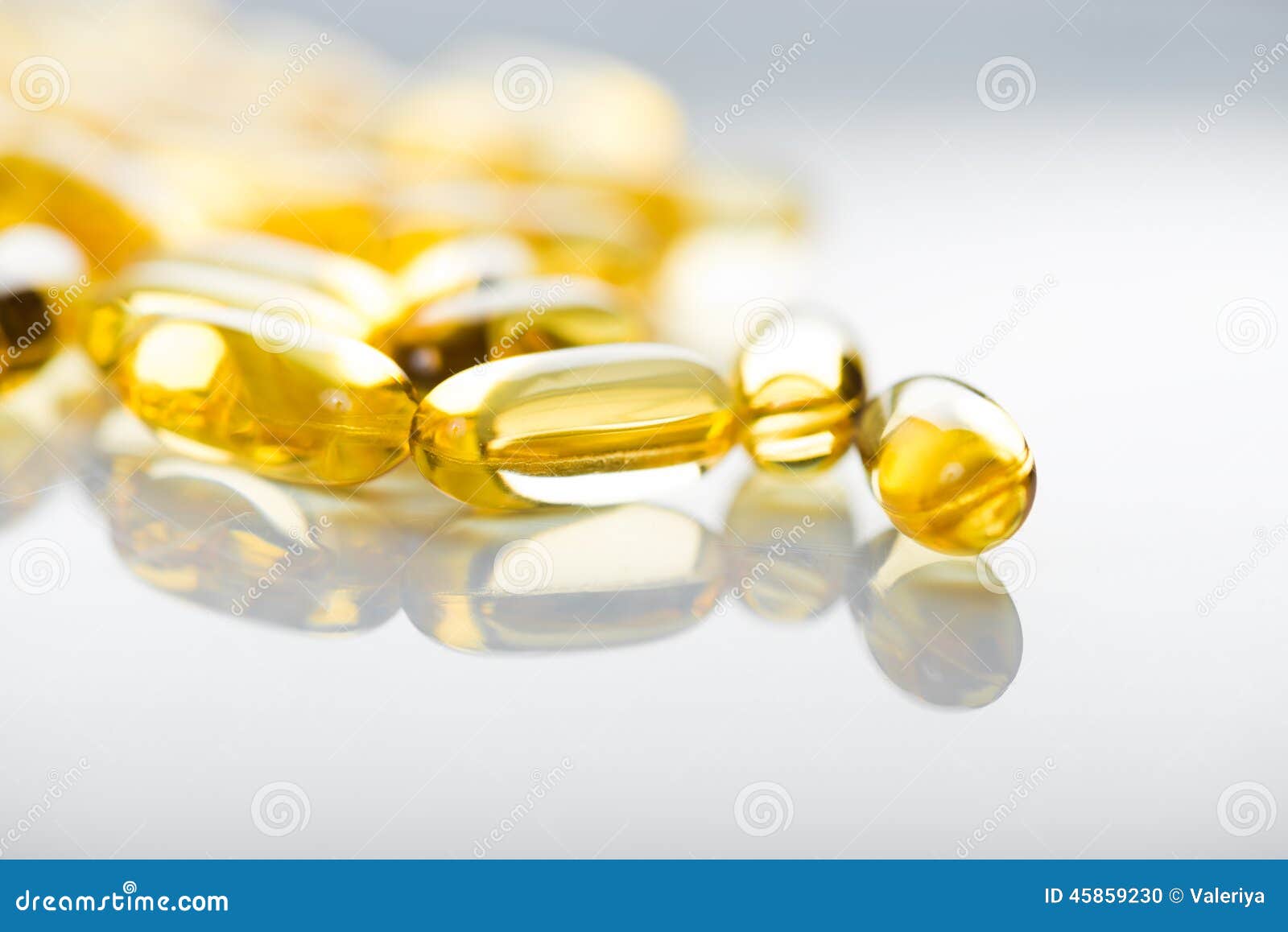 Shiny Yellow Vitamin E Fish Oil Capsule Stock Photo Image of capsule, food 45859230