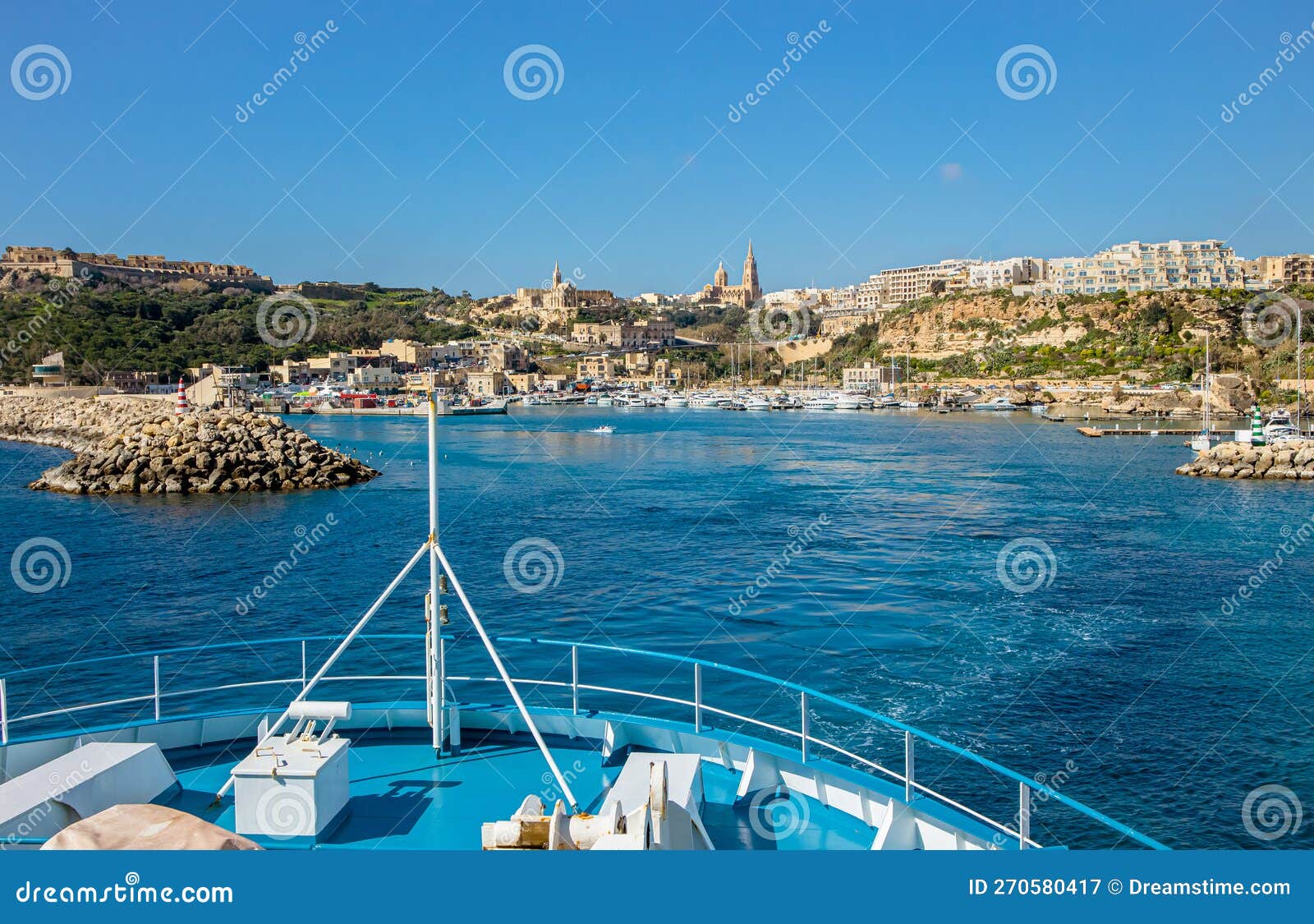 the ship arrives at the port of m?arr on the island of gozo, malta.