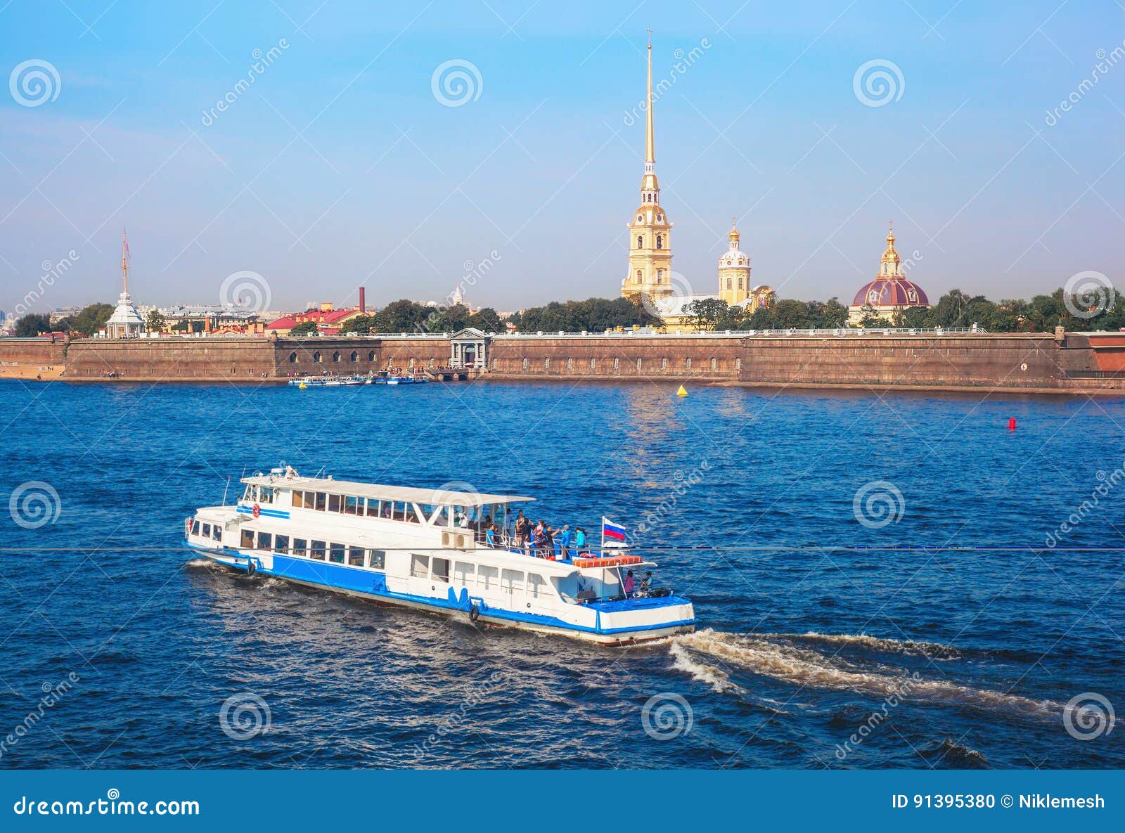 the ship sails along the neva river near the peter and paul fortress