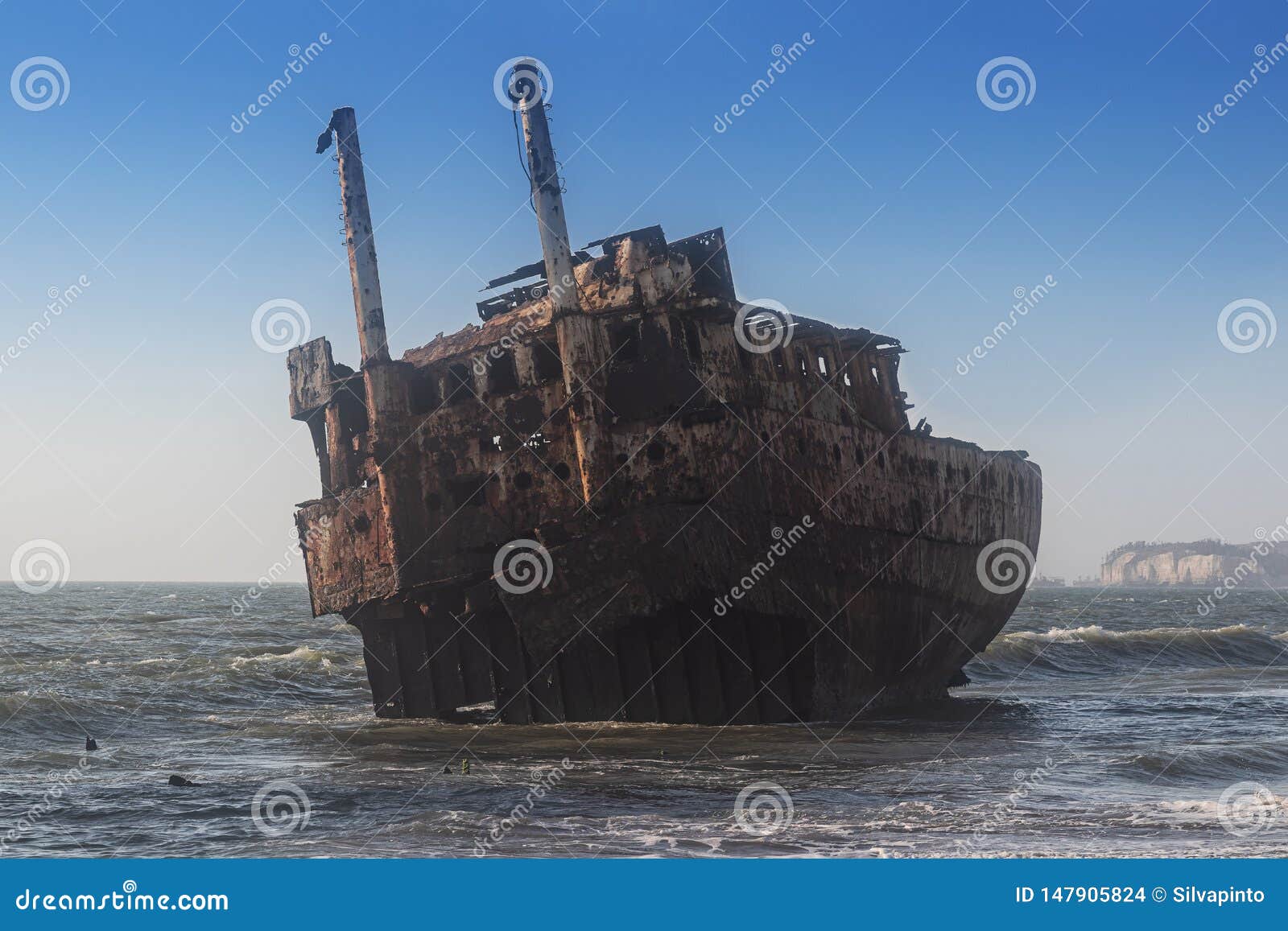 ship stranded near the beach shore of ships` cemeteries in angola