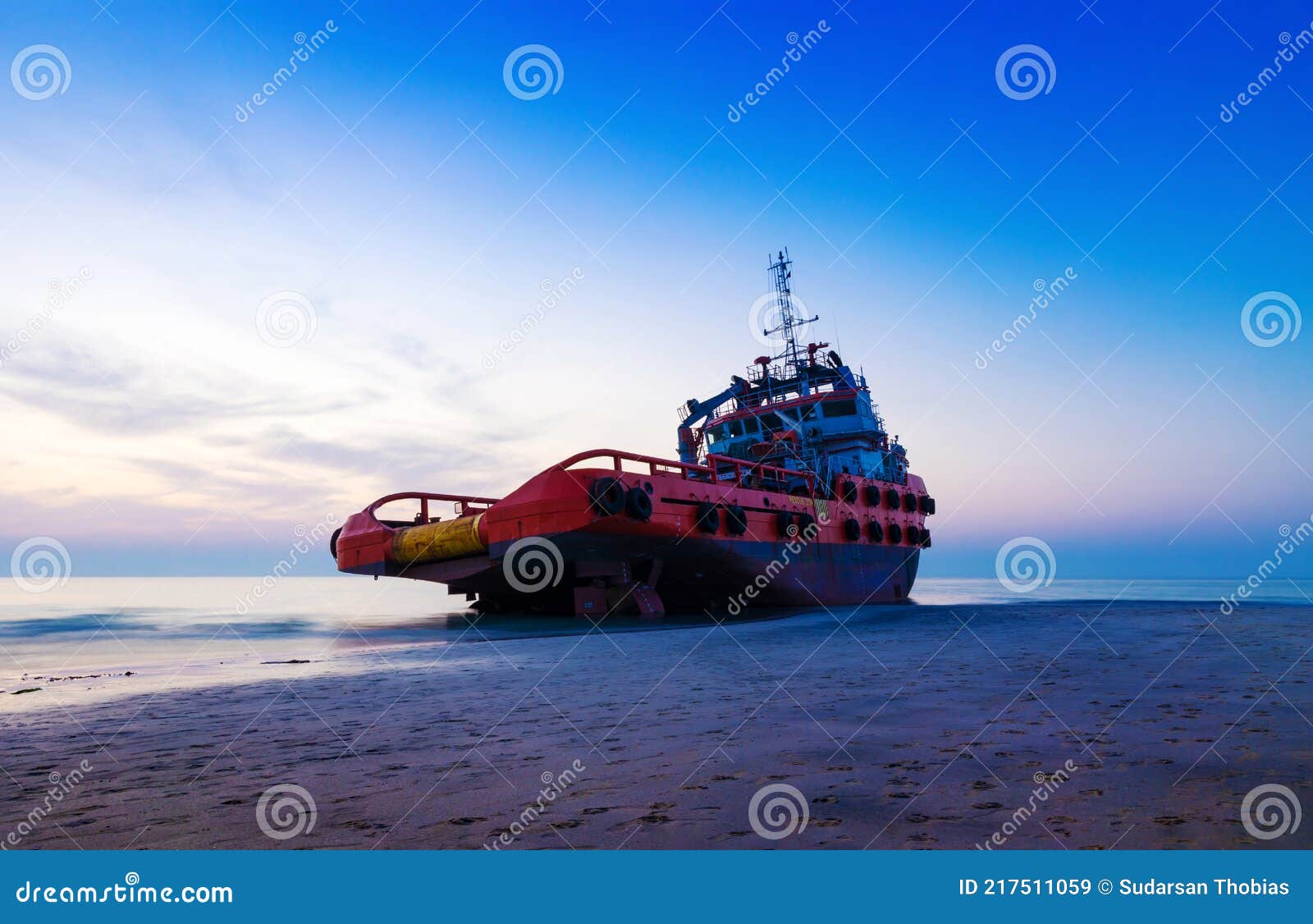 ship wreck along the umm al quwain coast in uae. a stranded or abandoned vessel on the beach.