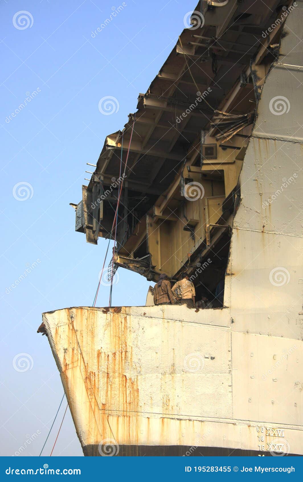 shipbreaking yard in darukhana, mumbai, india Ã¢â¬â ins vikrant dismantling with scrap metal & workers in background