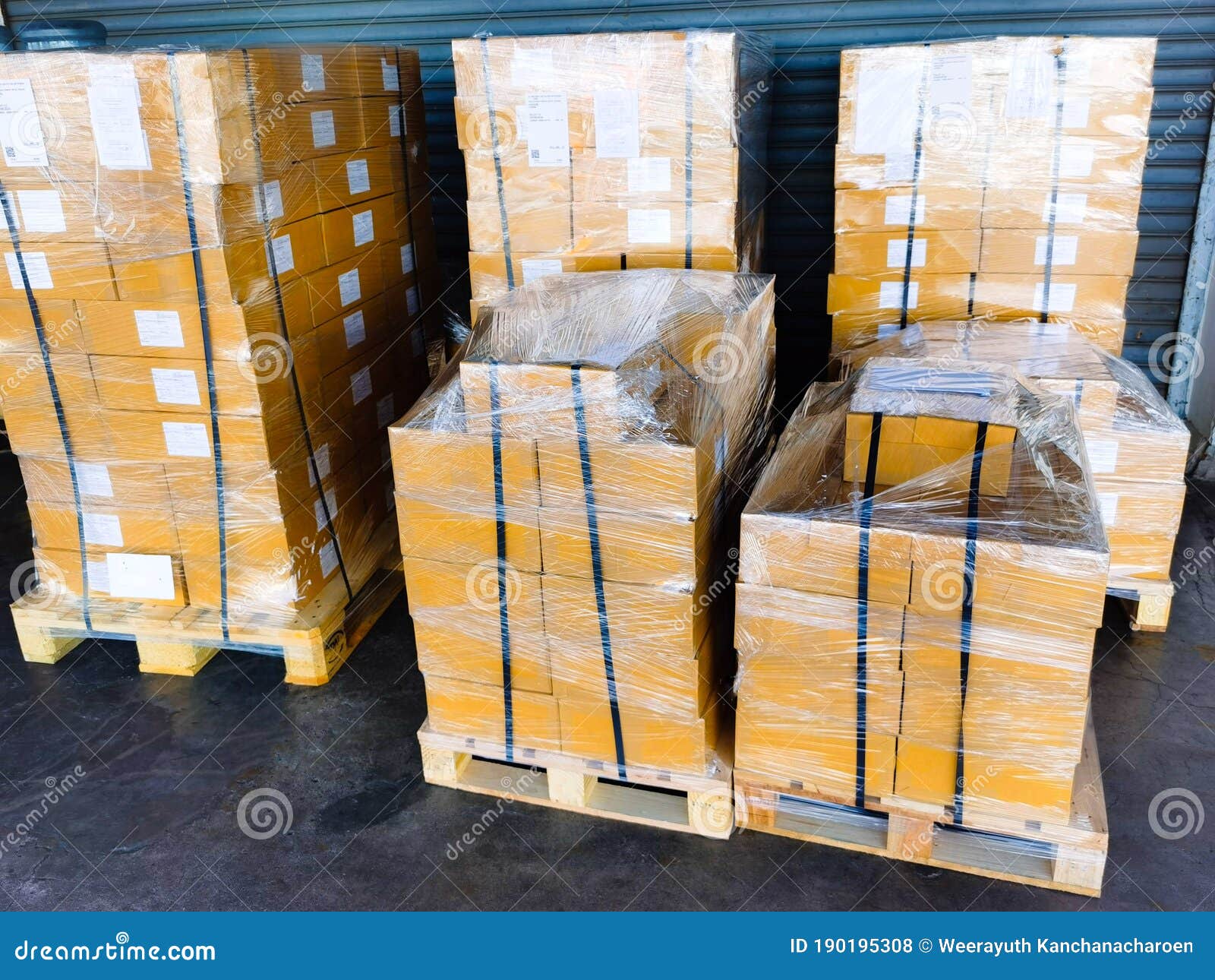Shipment Cartons Box On Pallets And Wooden Case On Hand Lift In Interior Warehouse Cargo For