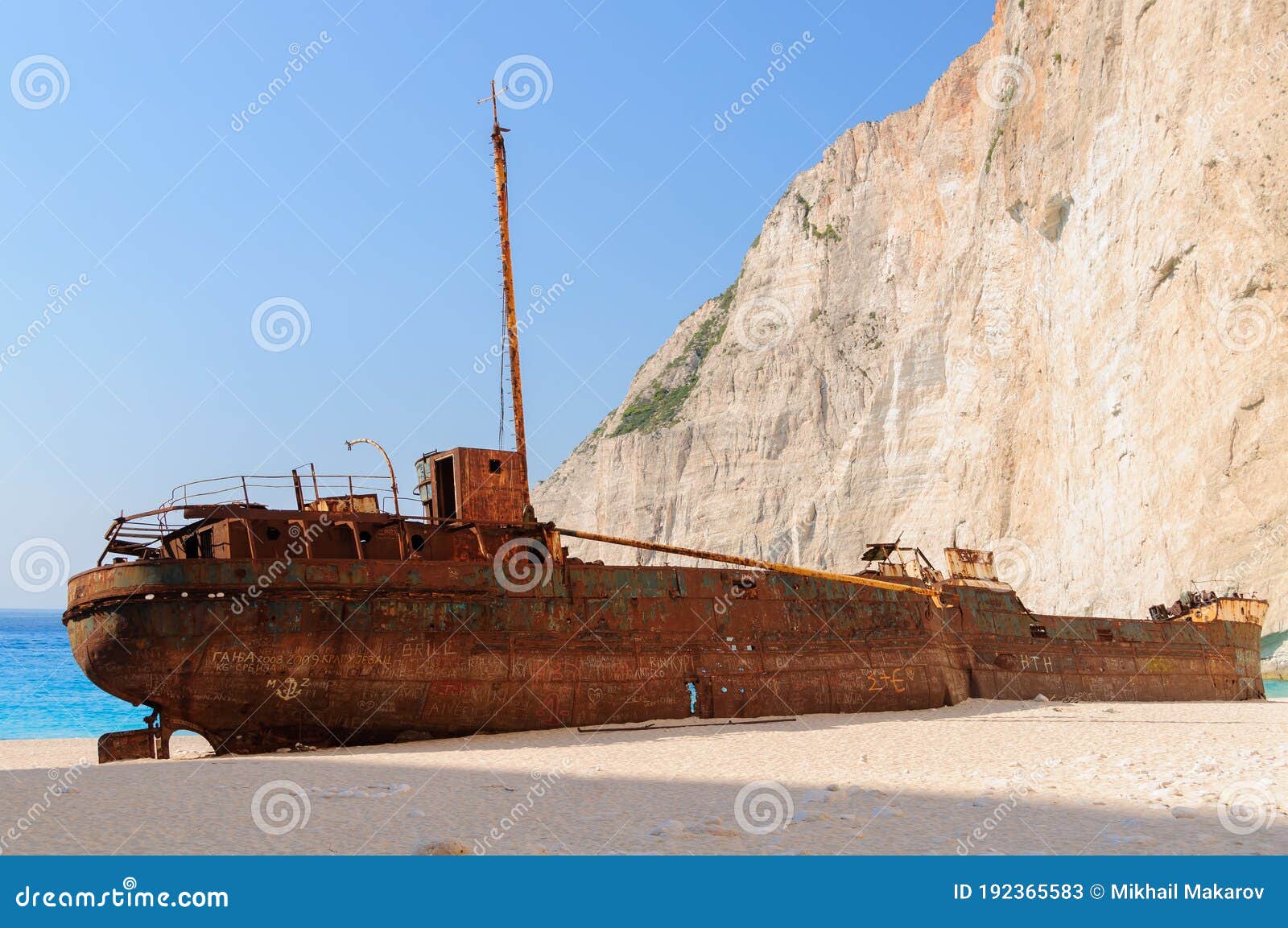 shipwreck beach with remainder of wrecked ship on zakynthos island