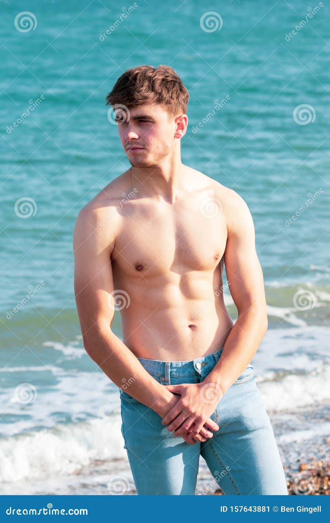 Shirtless on a beach stock image. Image of muscles, young - 157643881
