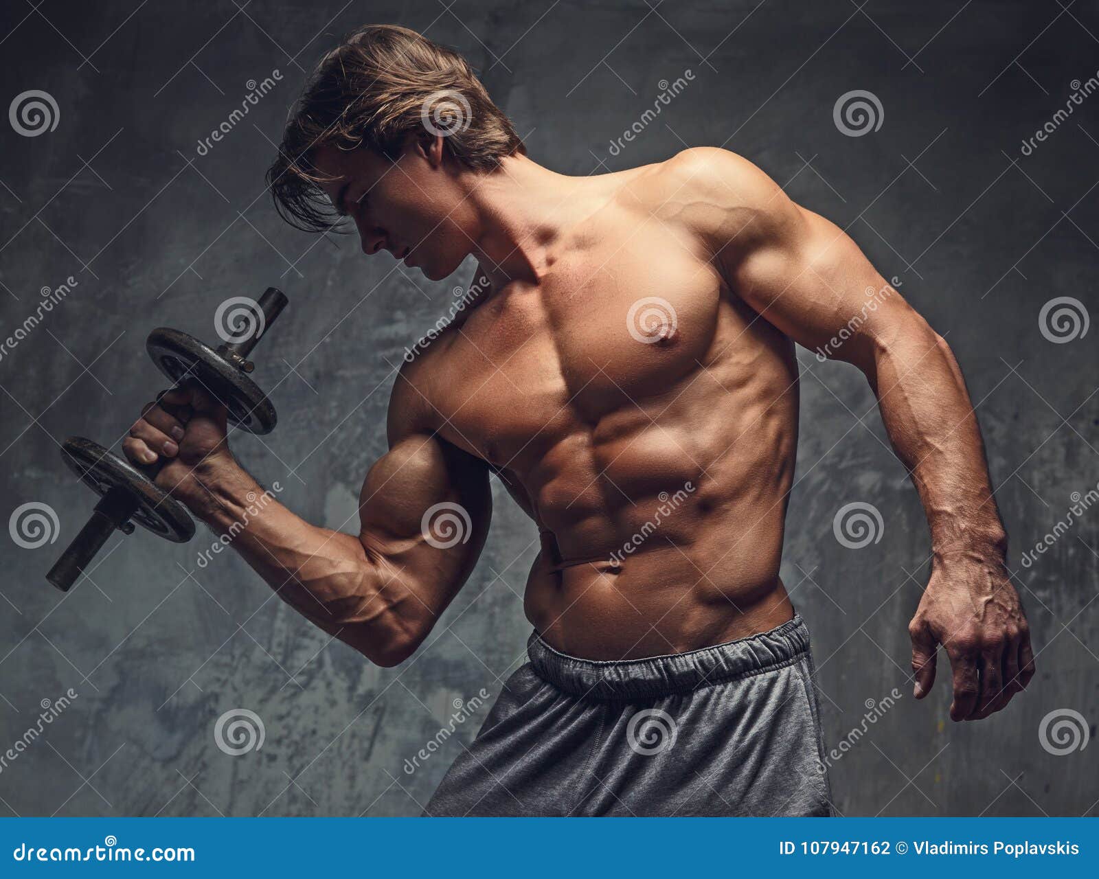 Shirtless Bodybuilder Doing Exercises. Stock Photo Image of macho