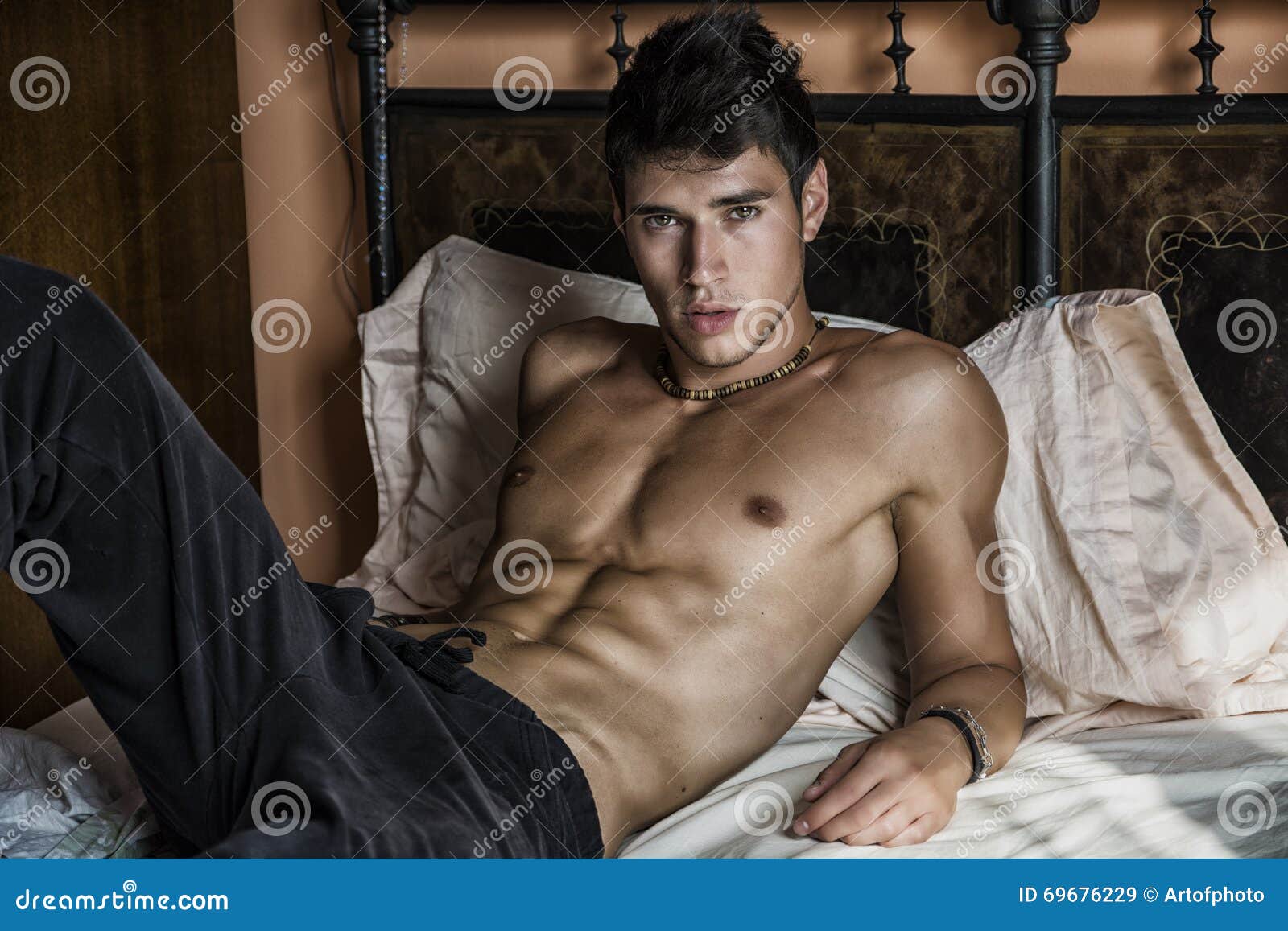 Shirtless Male Model Lying Alone On His Bed Stock Image Image Of