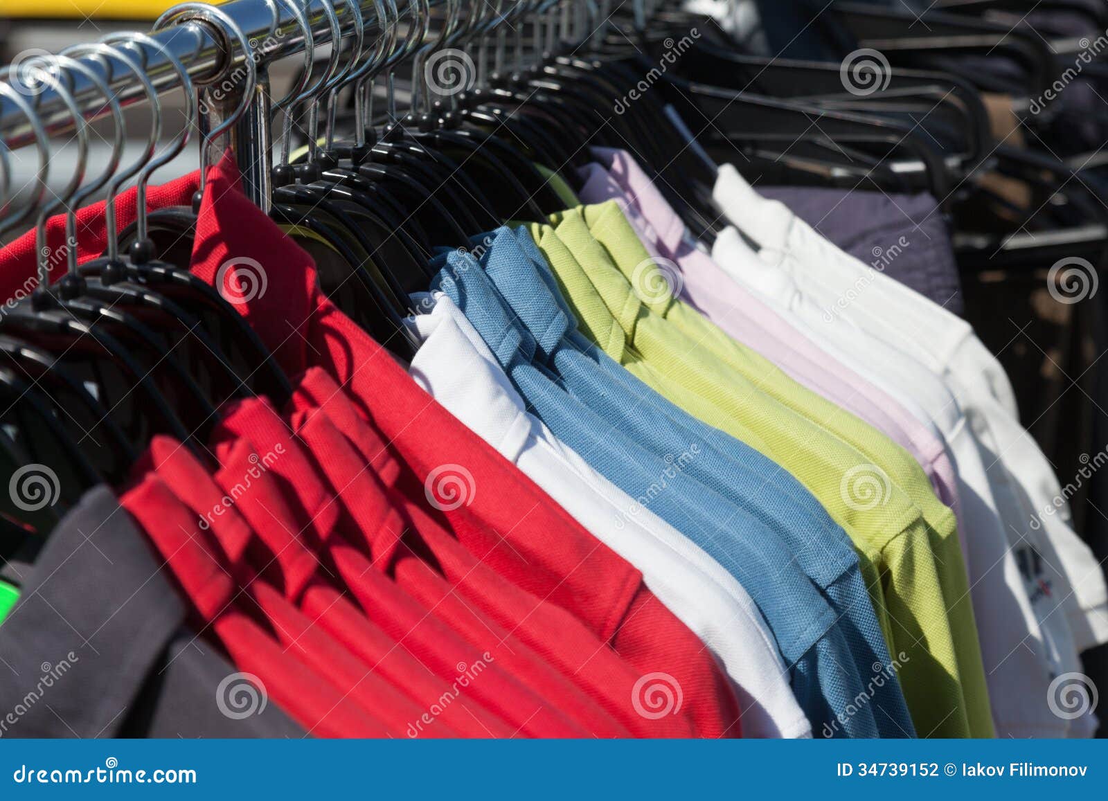 Shirts on hanger at shop stock photo. Image of hangers - 34739152