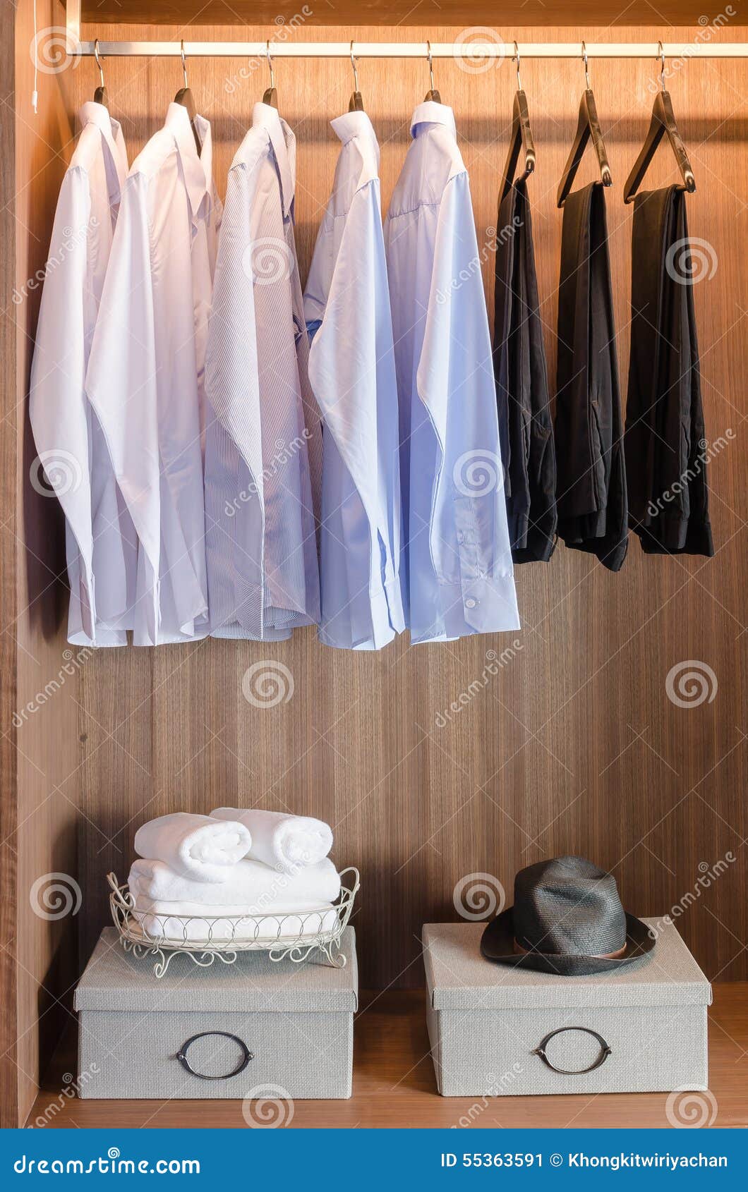 Shirts and Pants Hanging on Rack in Wooden Wardrobe Stock Image Image