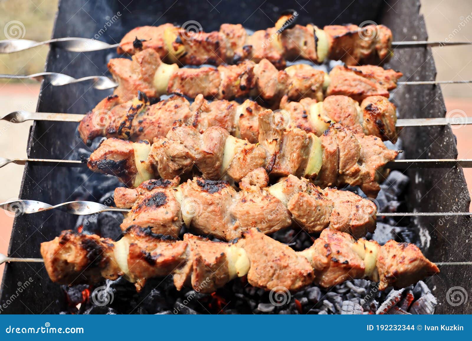 shish kebab roasting on the grill. close-up. a dish consisting of small pieces of meat, chicken and vegetables threaded onto skewe