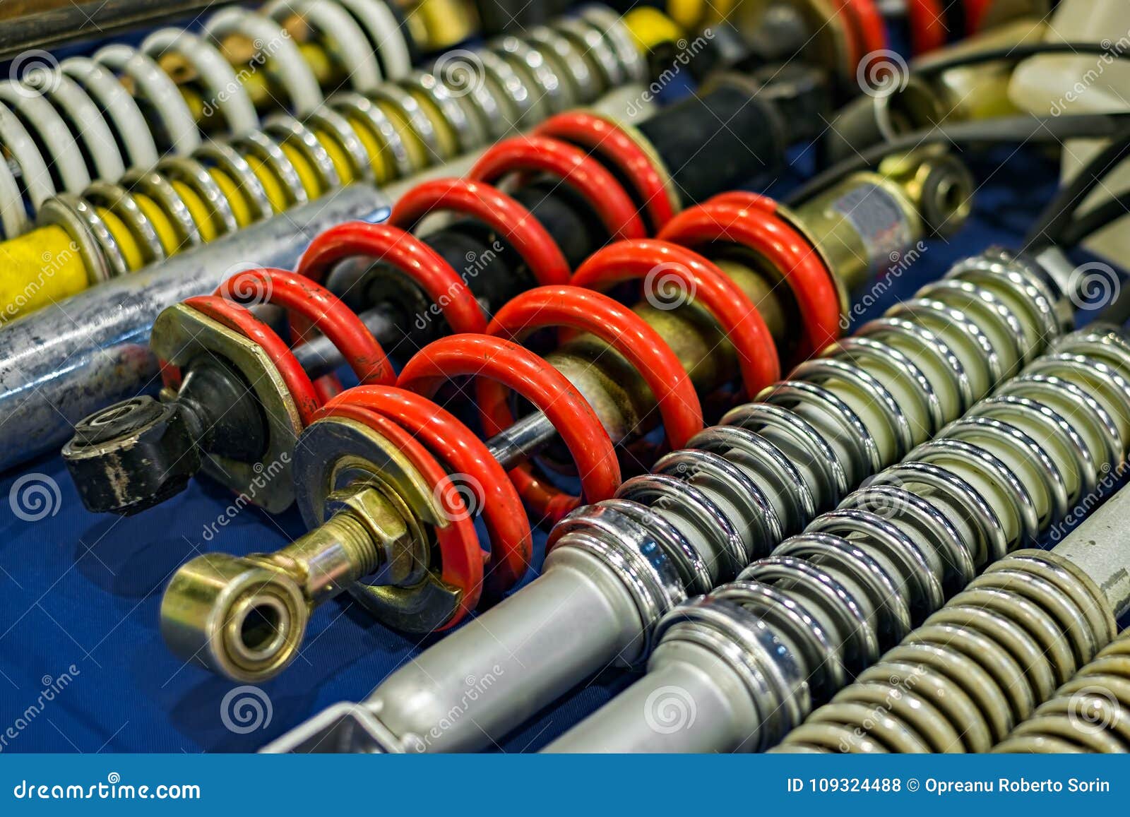 Shock Absorbers And Brake Pad In Undercarriage Of Bigfoot Car Is Stain