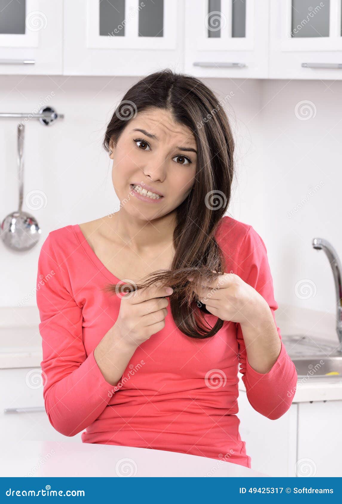 shocked and sad woman - broken hair after coloration.