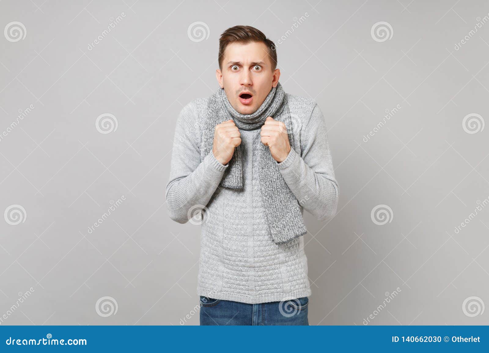 Shocked Scared Young Man in Gray Sweater, Scarf Keeping Mouth Wide Open ...