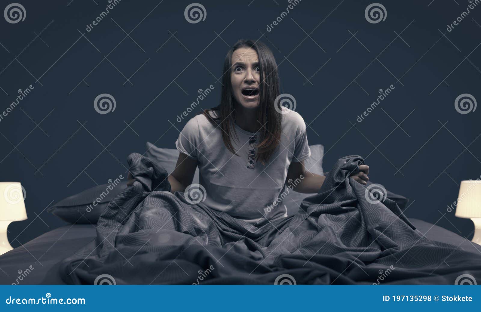 shocked woman waking up from a nightmare