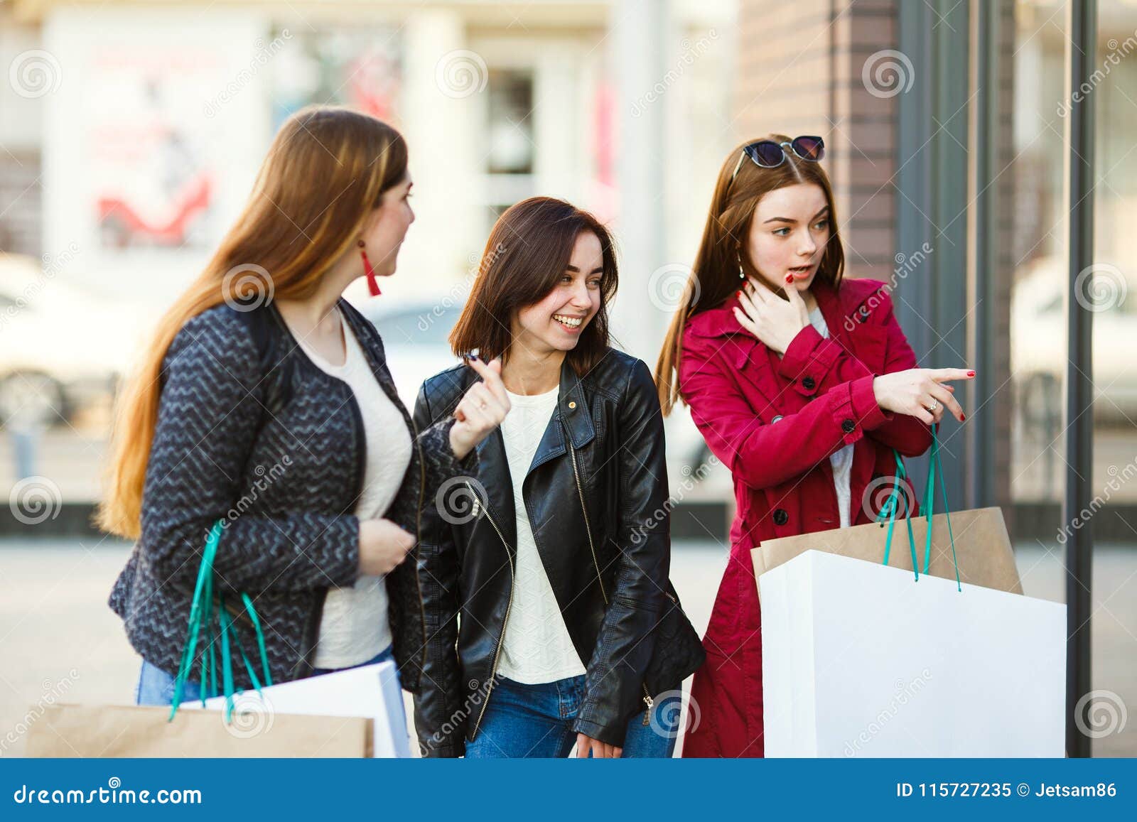 Woman With Shopping Bags Pointing At Shop Window Stock Image - Image of ...