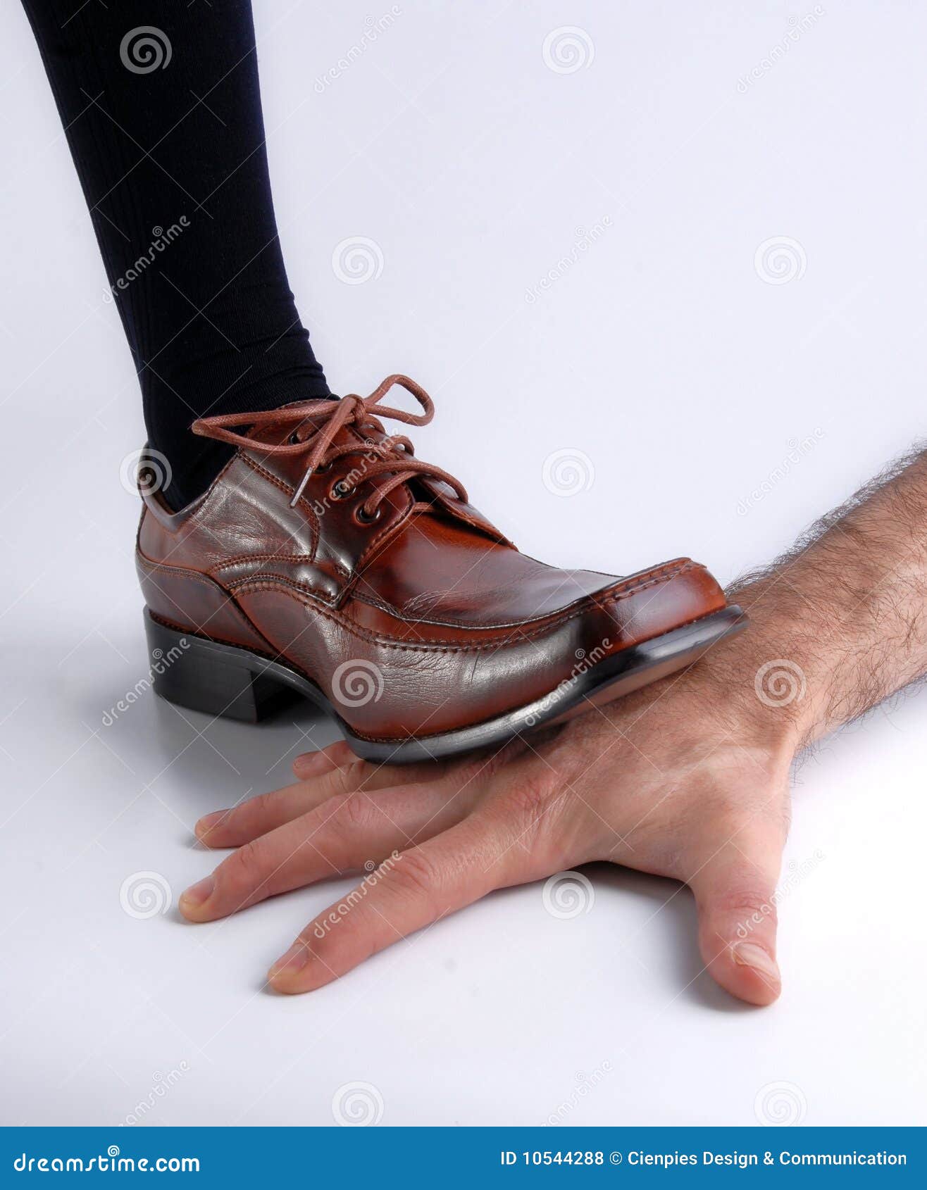 Shoe Crushing a Hand Over White Background Stock Photo Image of