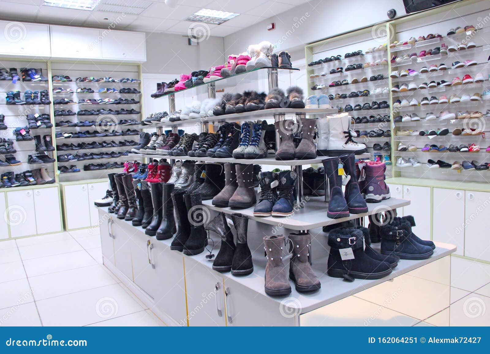 Shoe Shop with a Lot of Different Shoes Editorial Photo - Image of seller,  shelves: 162064251