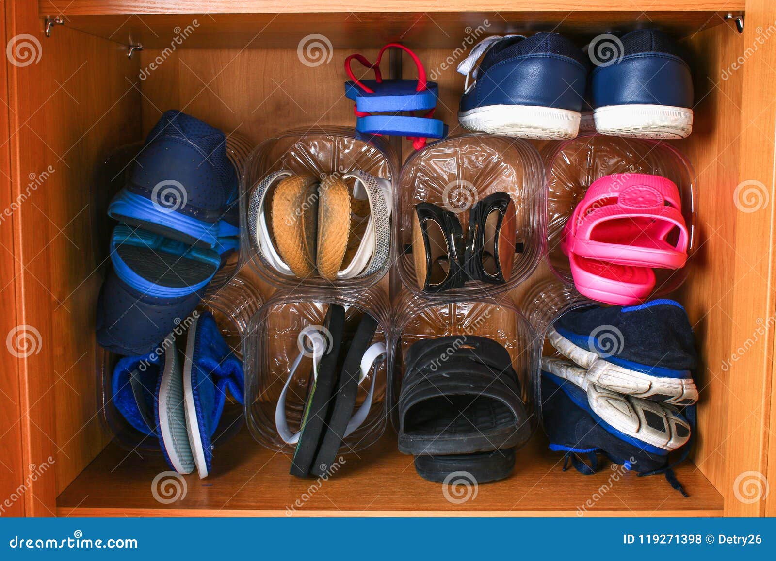 Shoe Storage in the Closet. Secondary Use of Plastic Bottles. Saving Space. Stock Photo Image