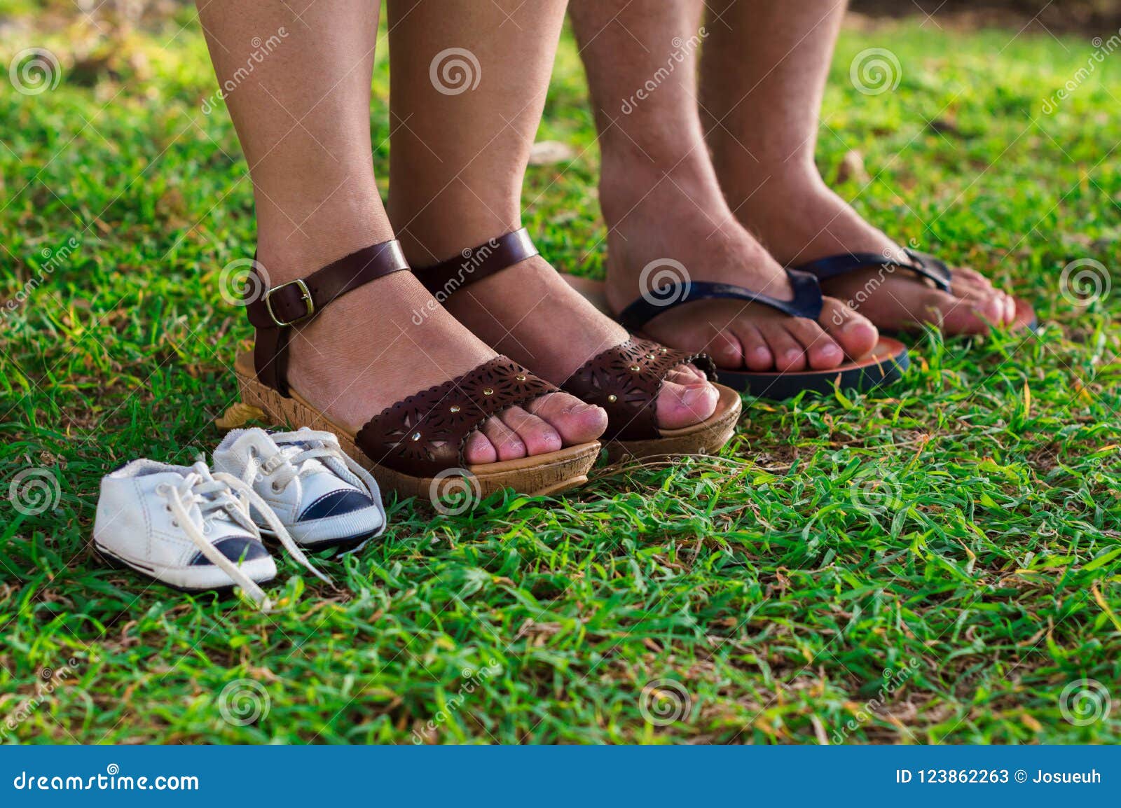 feet of pregnant woman, husband and son shoe