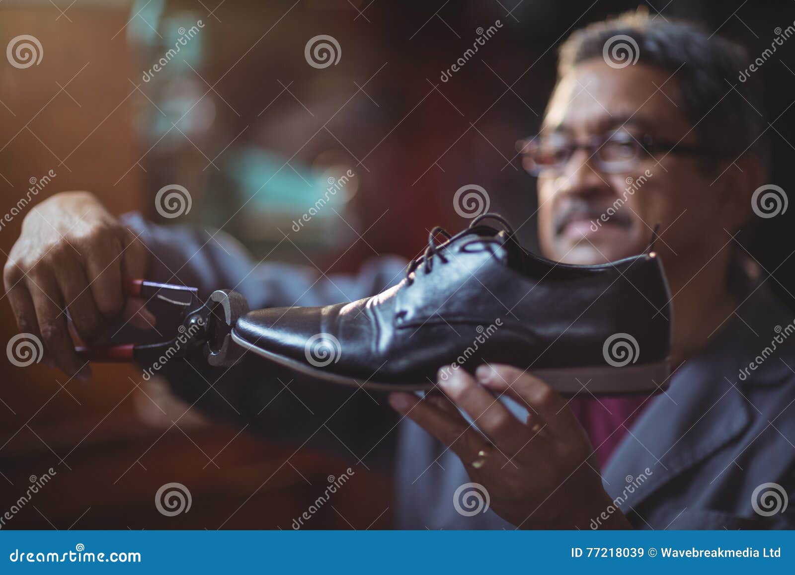 Shoemaker repairing a shoe stock image. Image of handmade 77218039