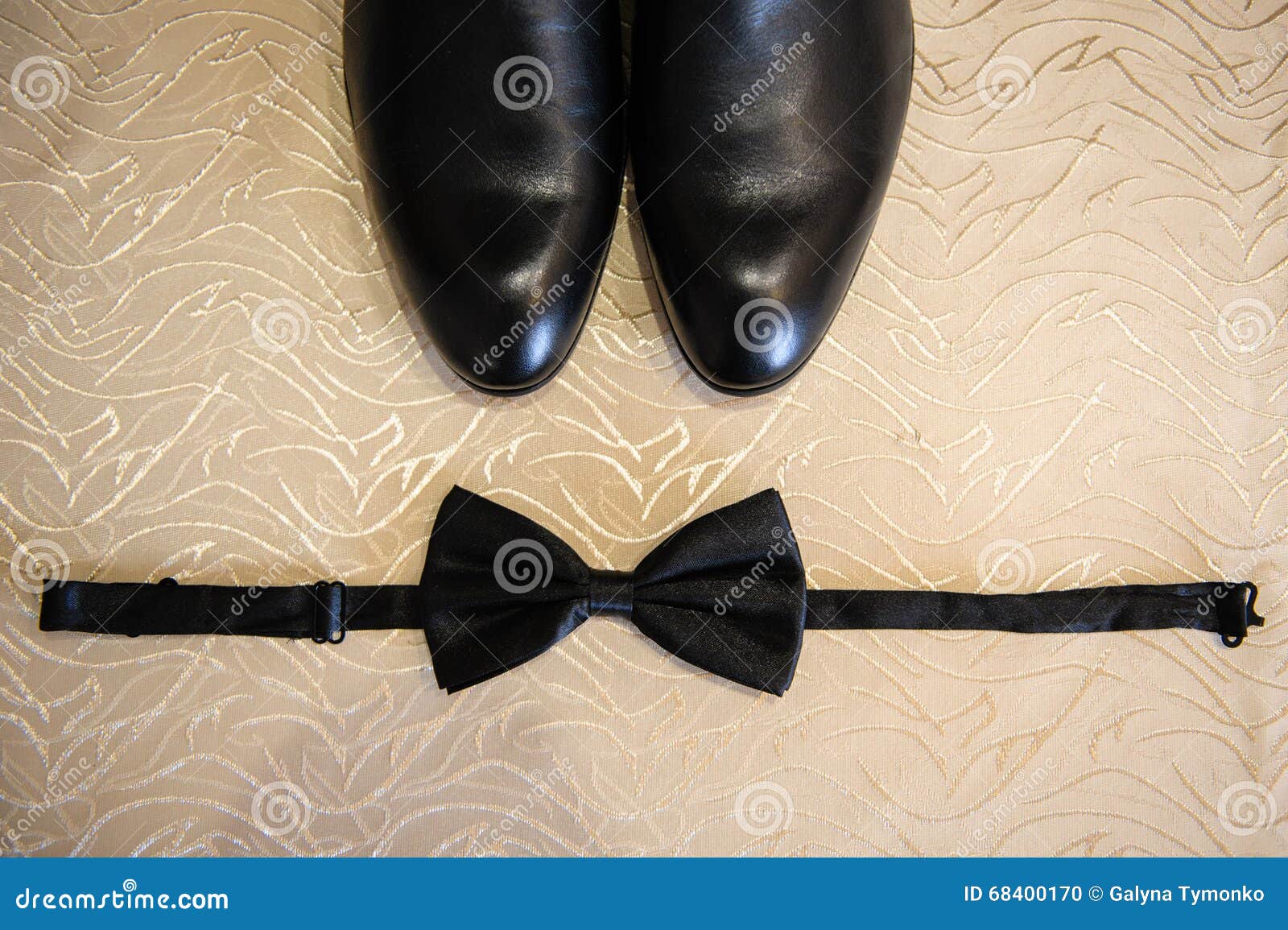 Shoes and Bow Tie Lying on the Wooden Floor Stock Photo - Image of ...