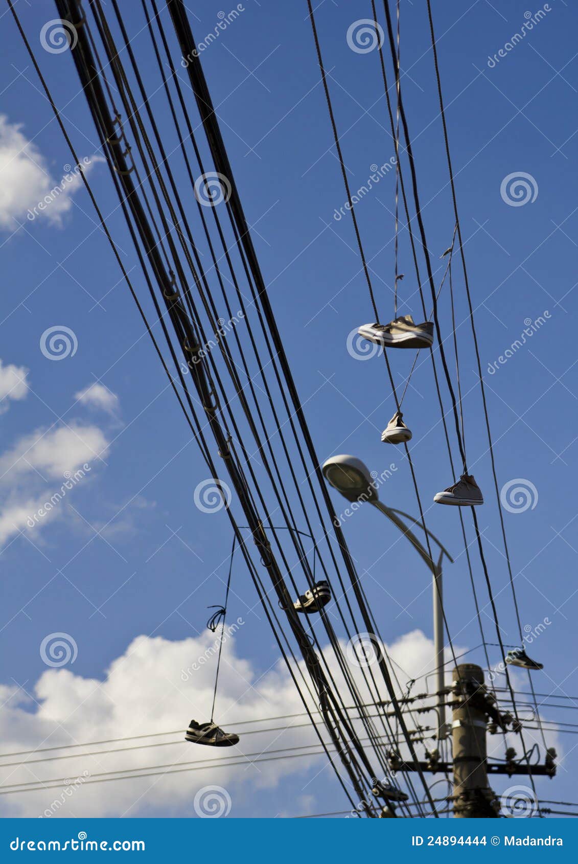 Sneakers on Power Line Stock Photo - Alamy