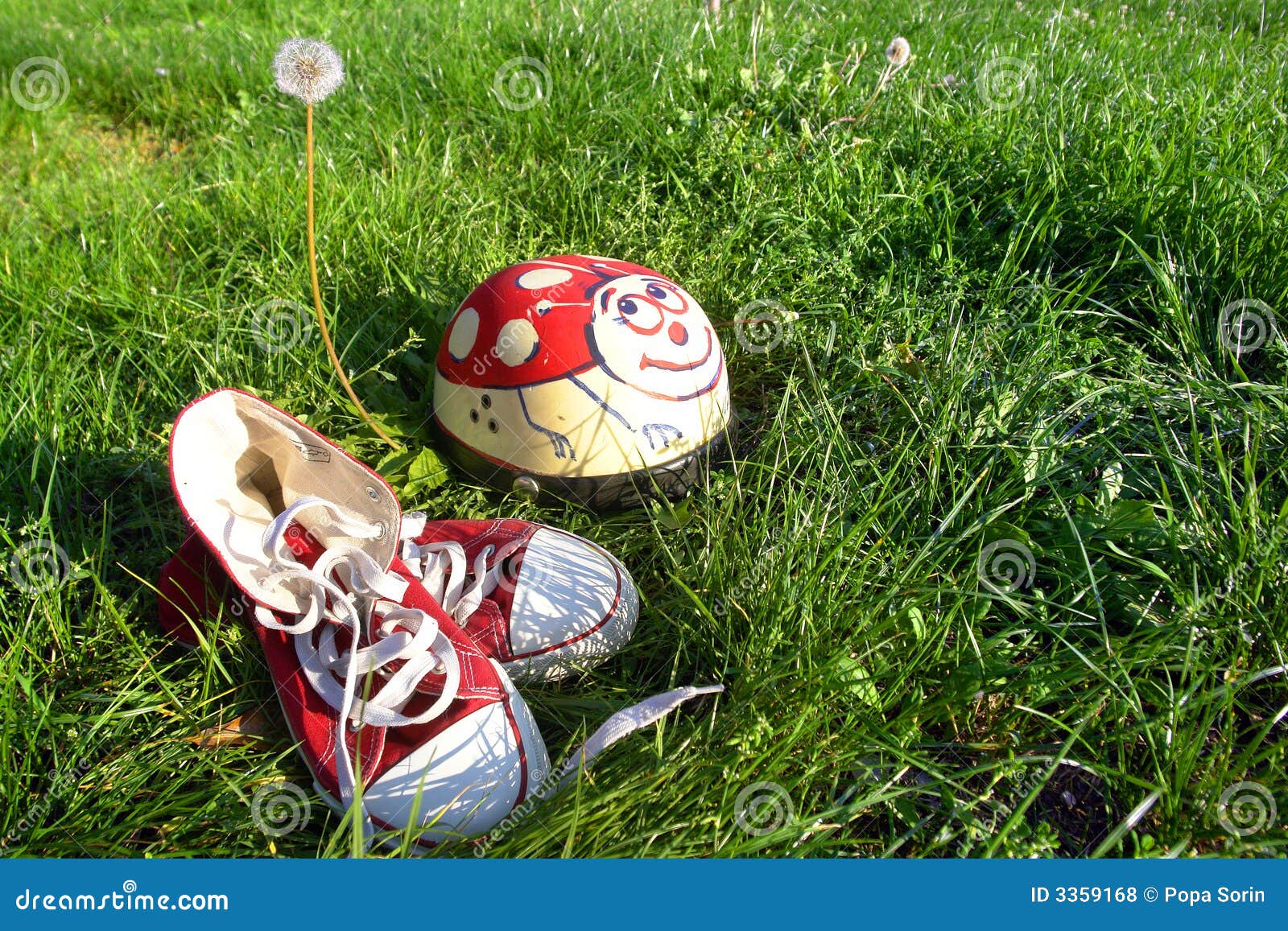 Shoes and helmet on grass stock photo. Image of laces 3359168