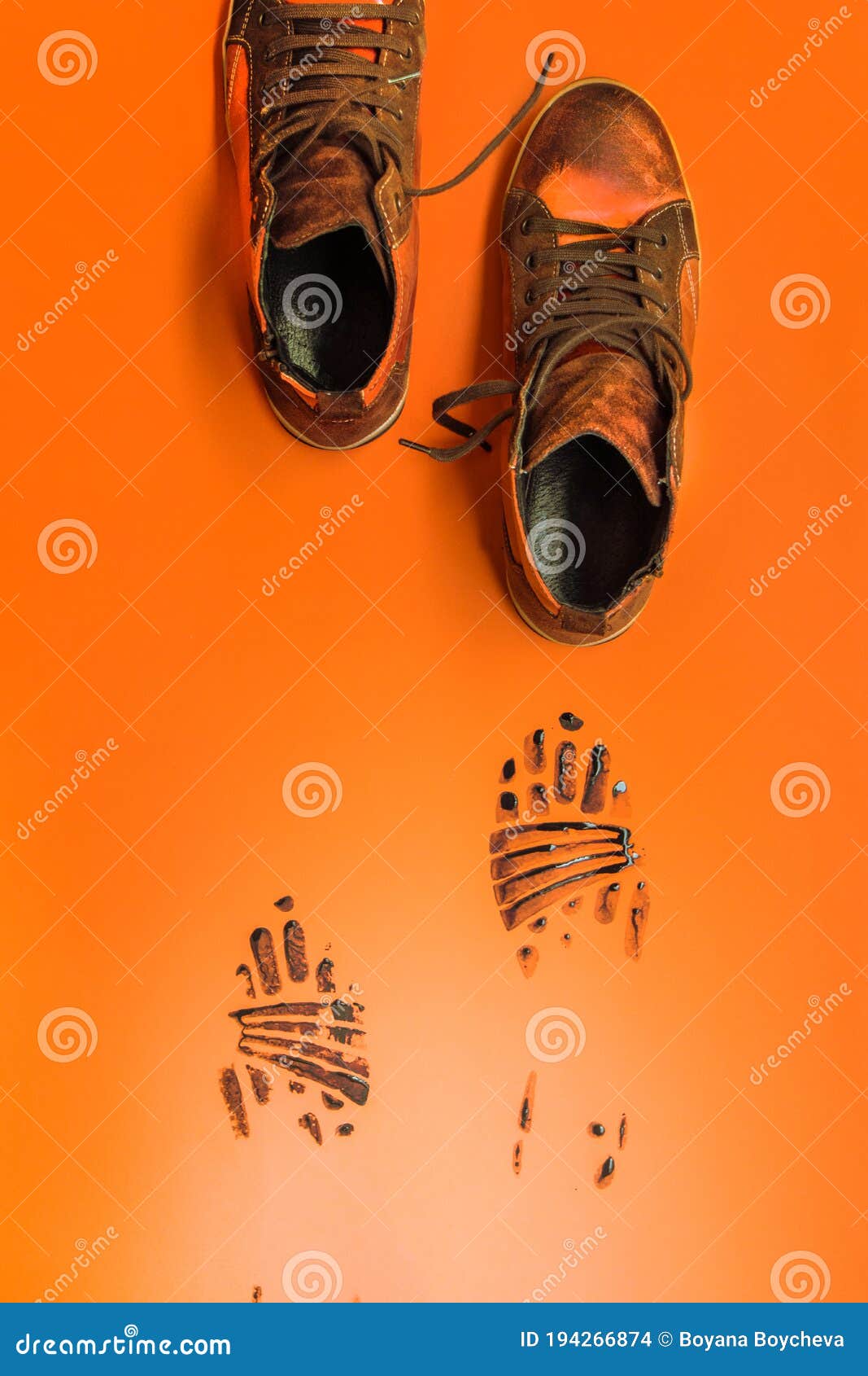 Shoes Leaving Black Marks on an Orange Background Stock Photo Image