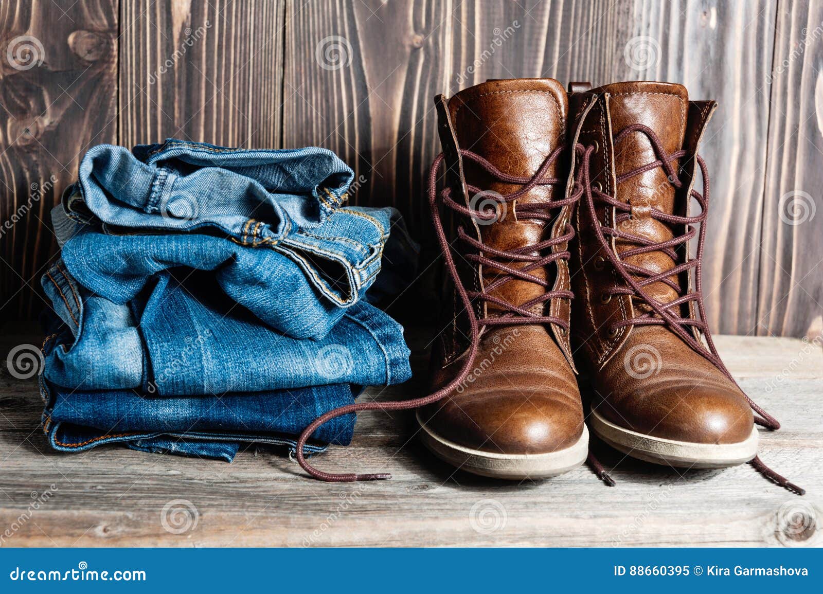 Shoes and stack of jeans stock image. Image of accessory - 88660395