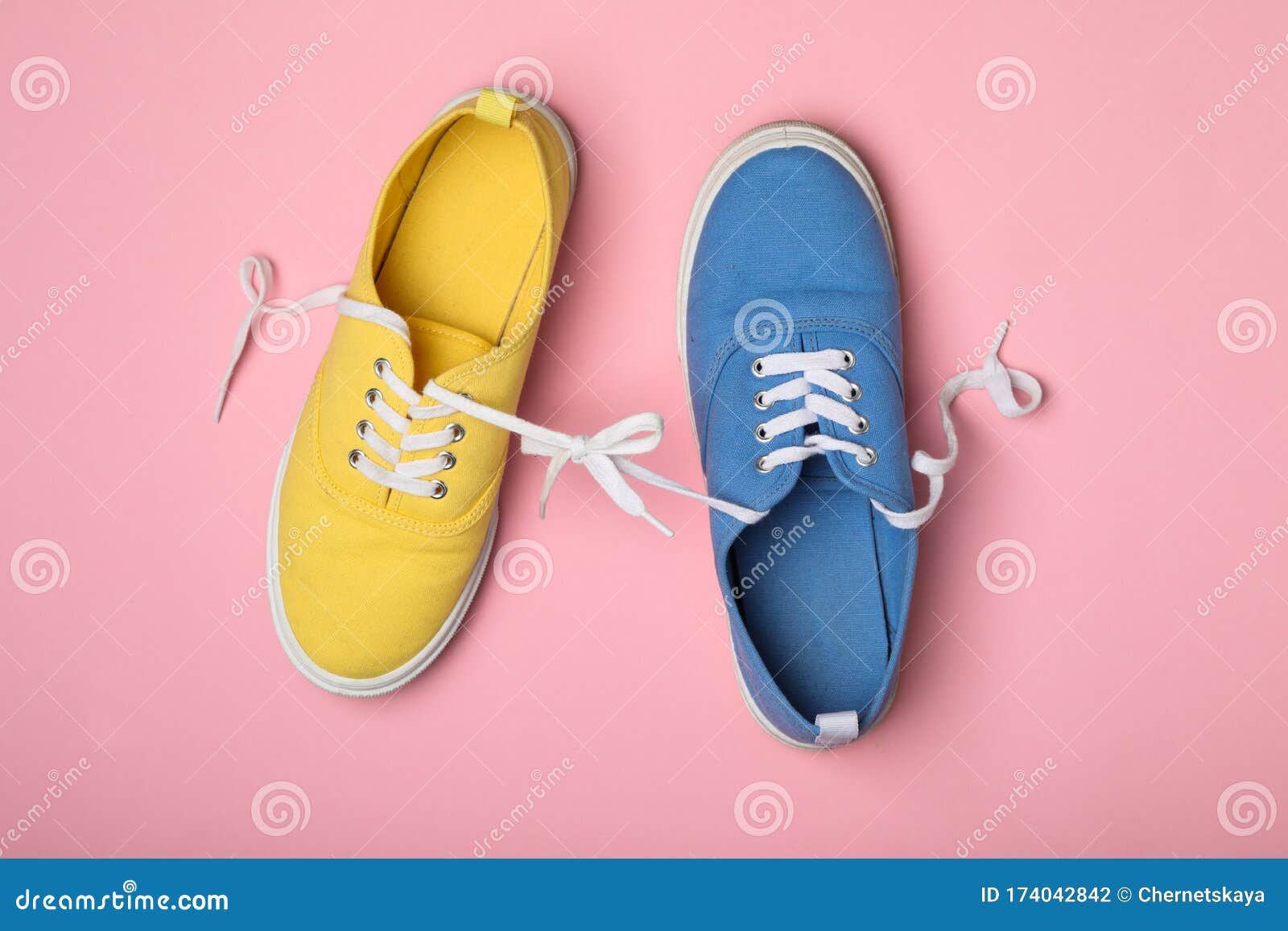 Shoes Tied Together on Pink Background. April Fool`s Day Stock Photo ...