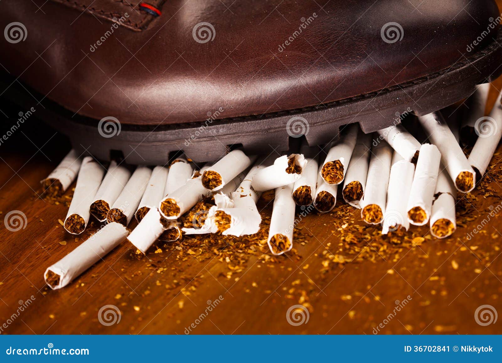 Shoes Trampling Down on Cigarettes Stock Image Image of shoe