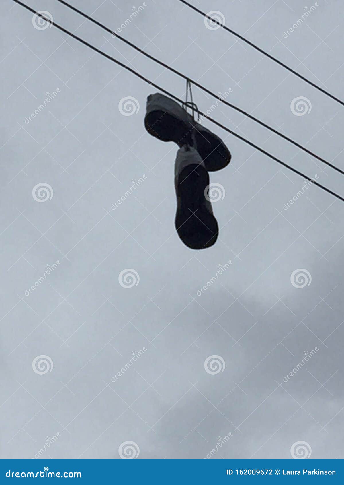 Shoes on a wire stock photo. Image of electric, wire 162009672