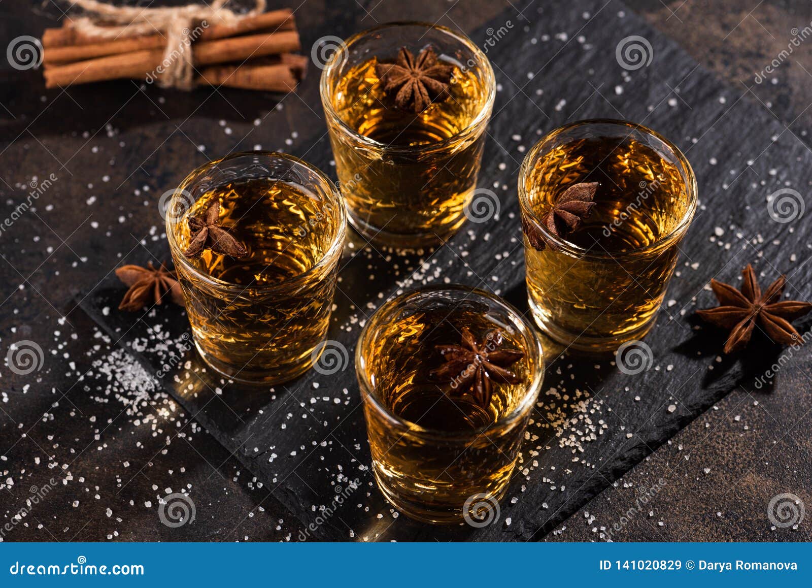 Shoot Glass of Alcoholic Drinks with Star Anise, Cinamon and Salt Stock ...