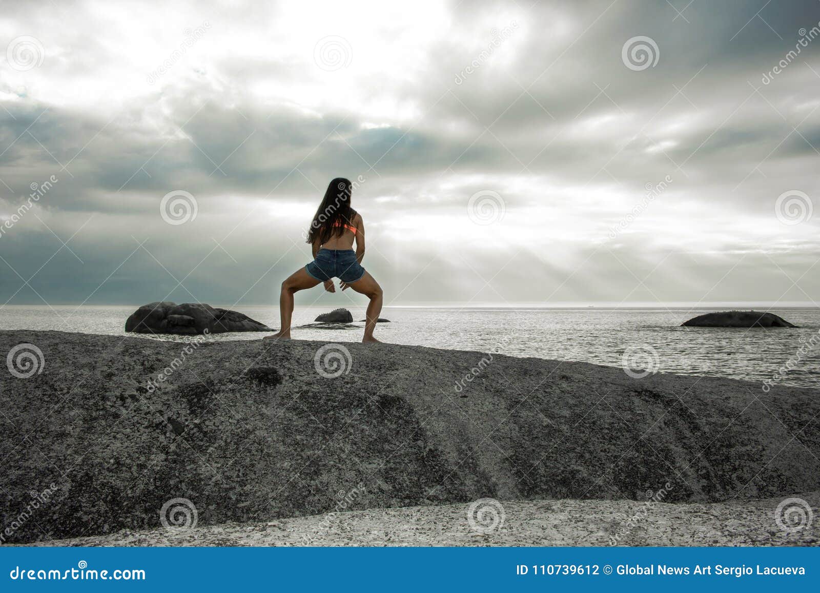 Woman Bending On A Rock At Sunset On Bakovern Beach Cape Town Stock Photo Image Of Seascape