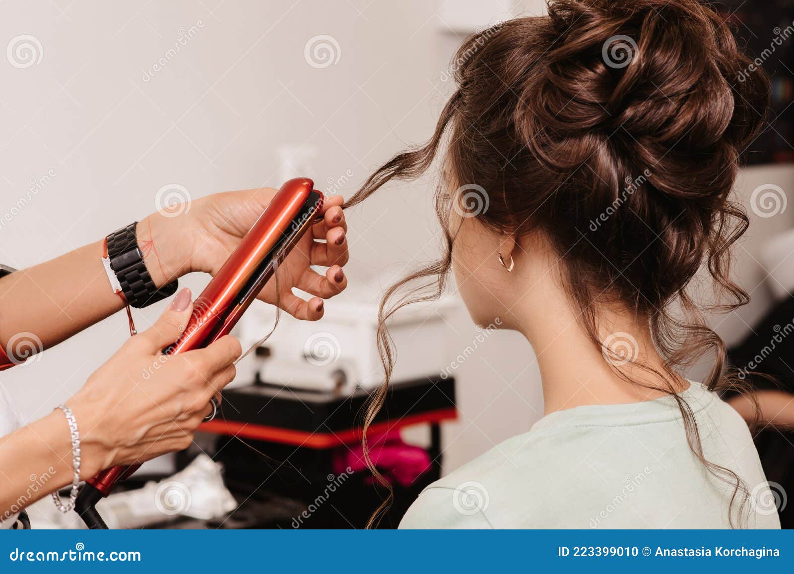 Shooting in a Beauty Salon. a Hair Stylist Makes a Hairstyle for a Young  Dark-haired Girl with the Help of a Hair Styler Stock Photo - Image of  professional, salon: 223399010