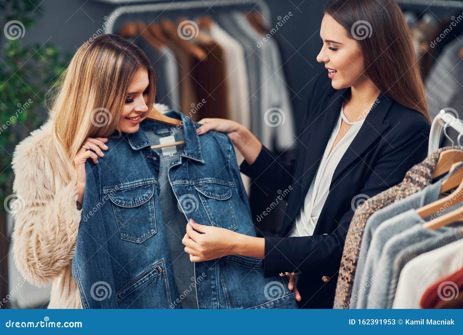 Shop Assistant Helping Customer in Boutique Stock Image - Image of ...