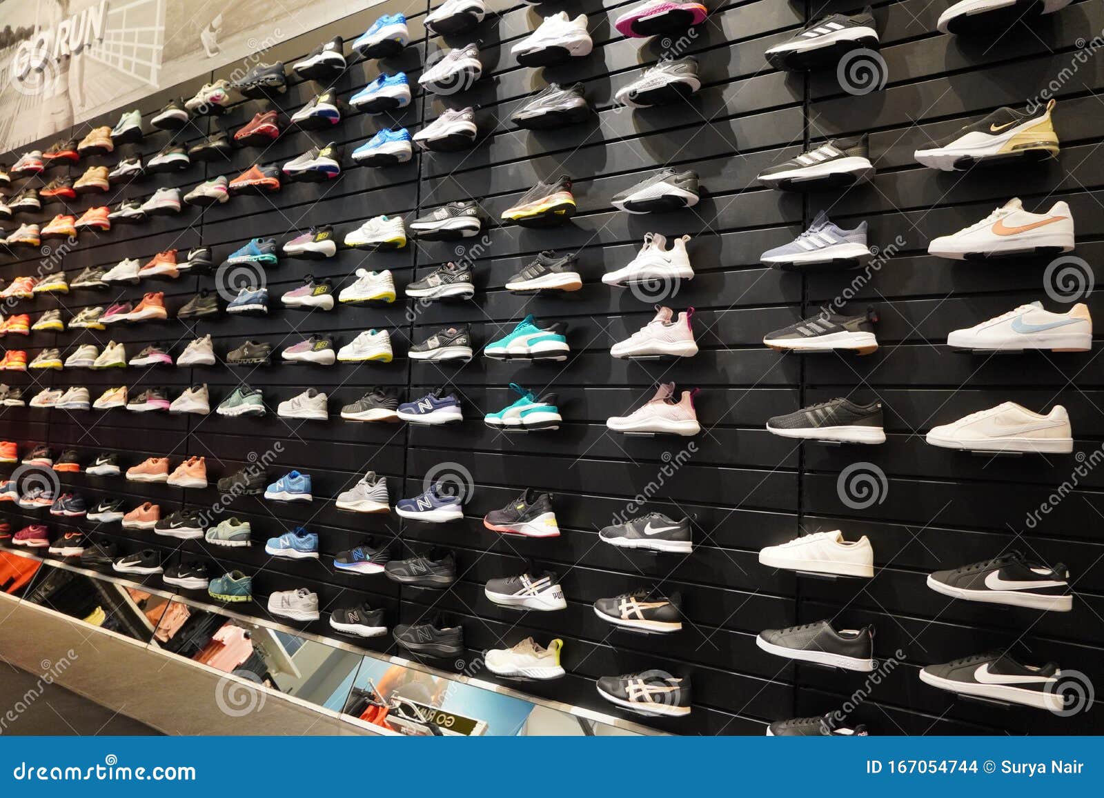 Shop Display of a Lot of Sports Shoes on a Wall. a View of a Wall of ...