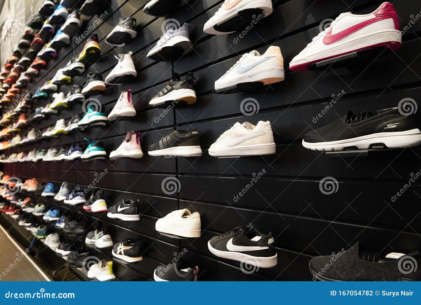 Shop Display of a Lot of Sports Shoes on a Wall. a View of a Wall of ...