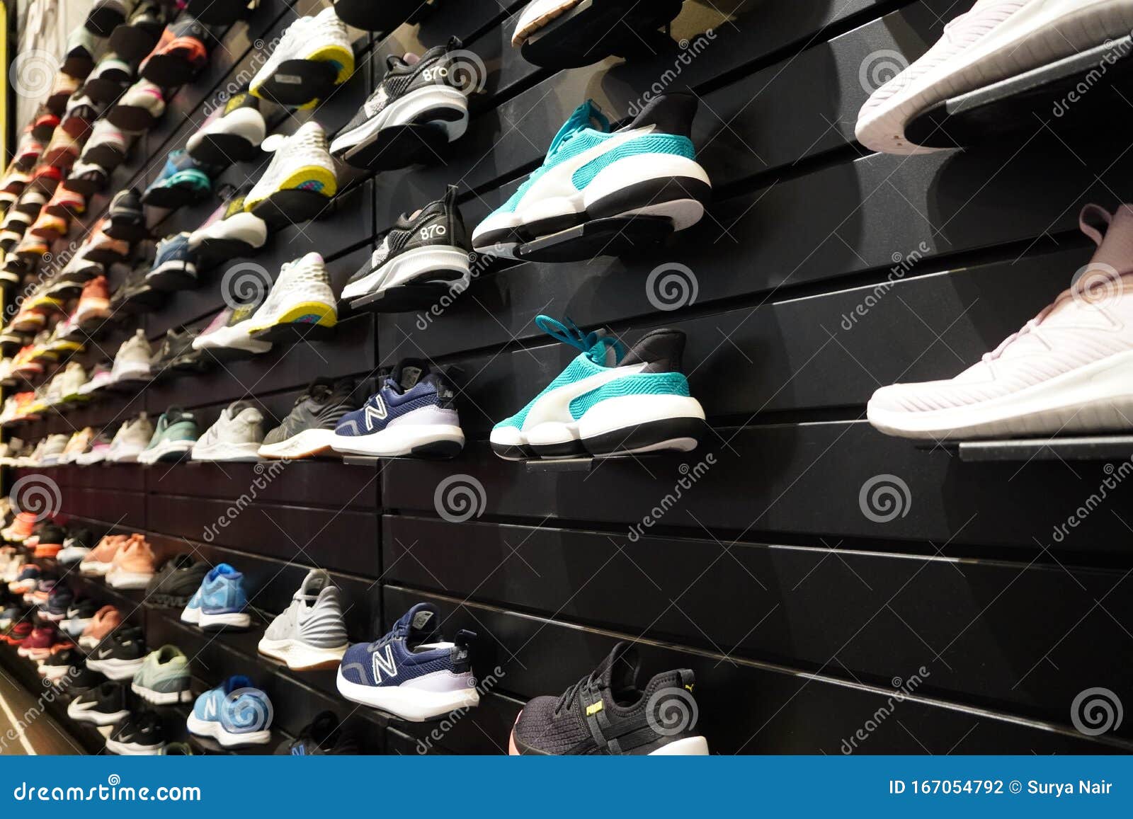 Shop Display of a Lot of Sports Shoes on a Wall. a View of a Wall of ...