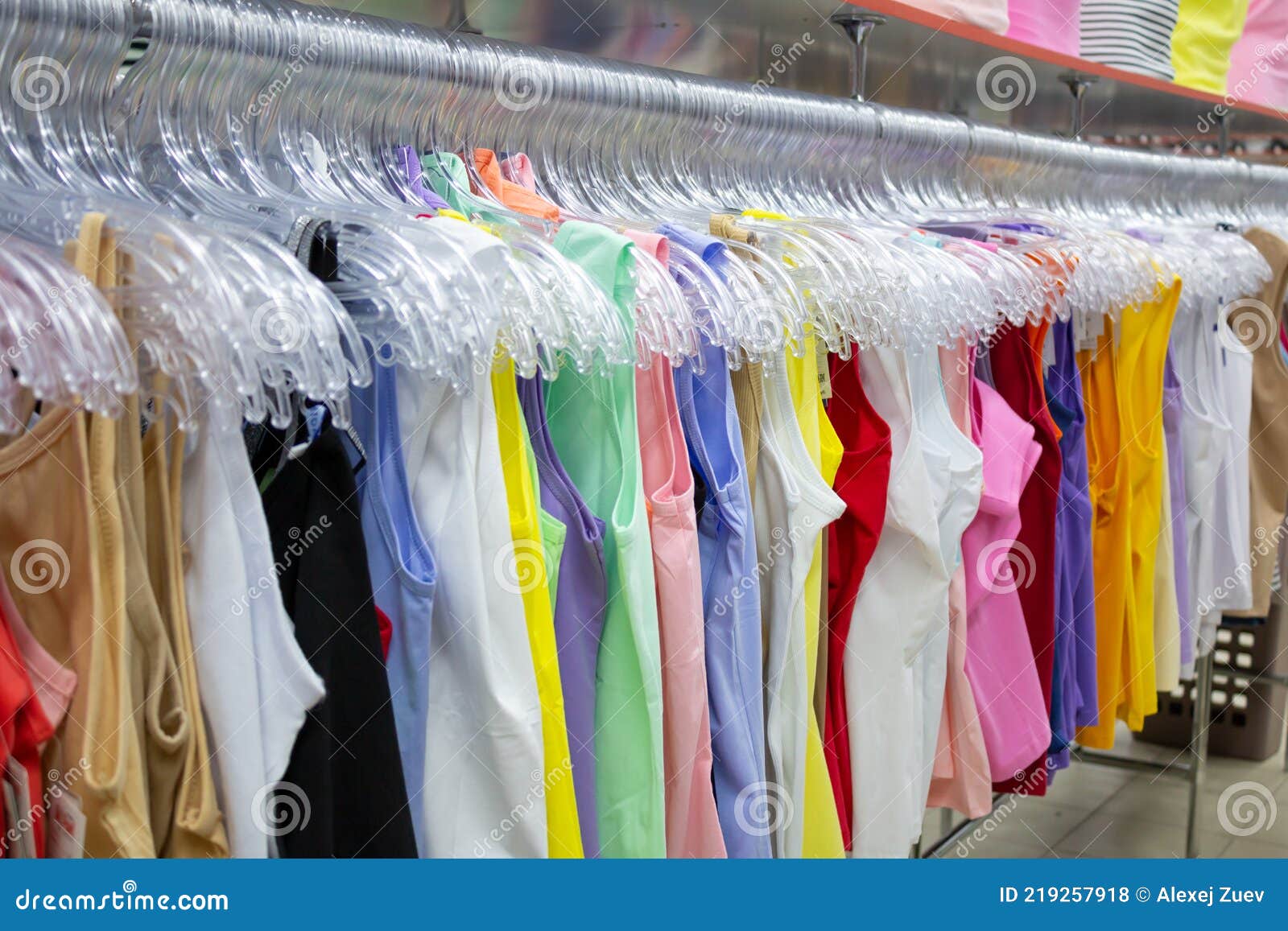 Shop hangers with clothes. stock photo. Image of shop - 219257918