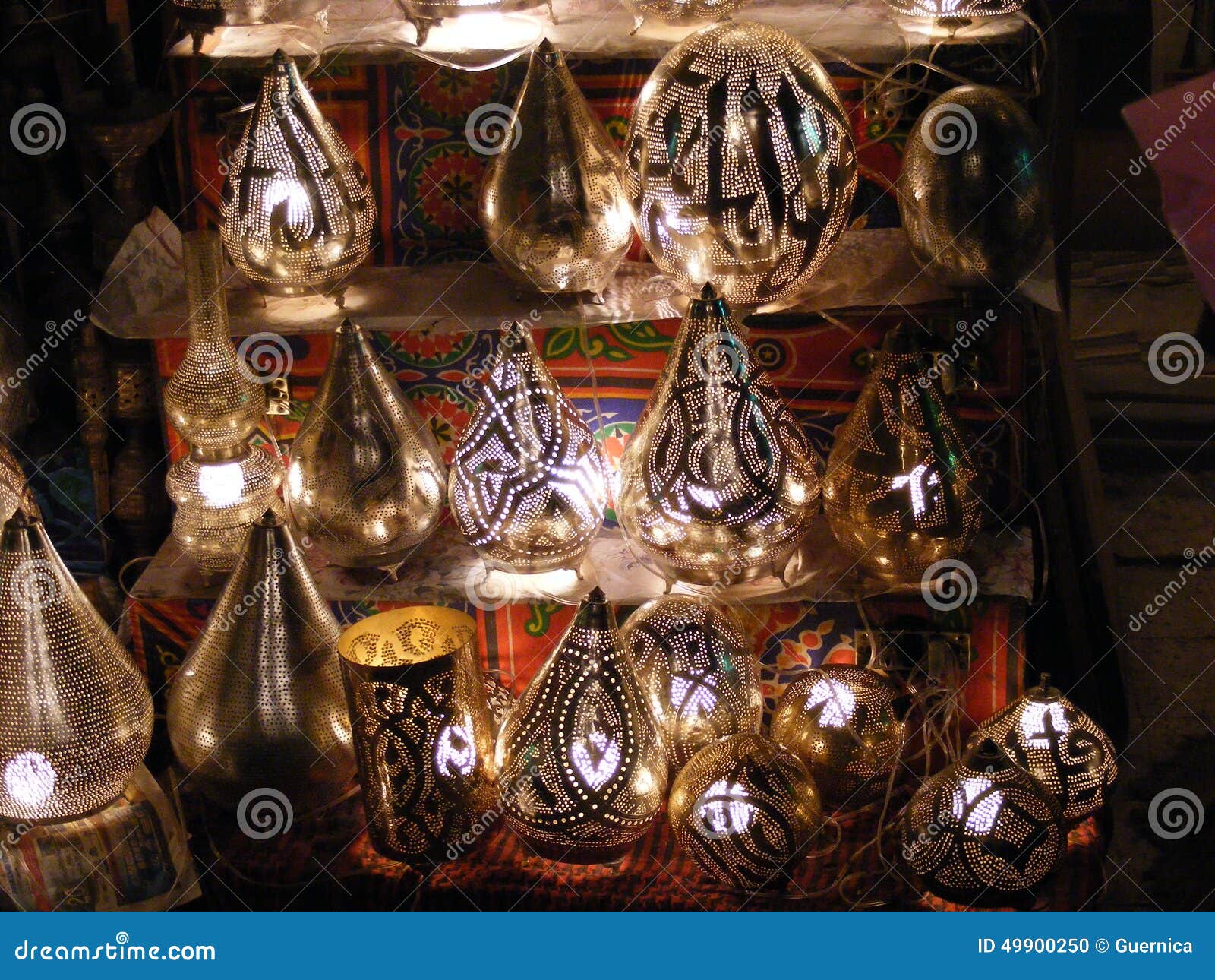 shop vendor selling copper lamps in khan el khalili souq market in egypt cairo