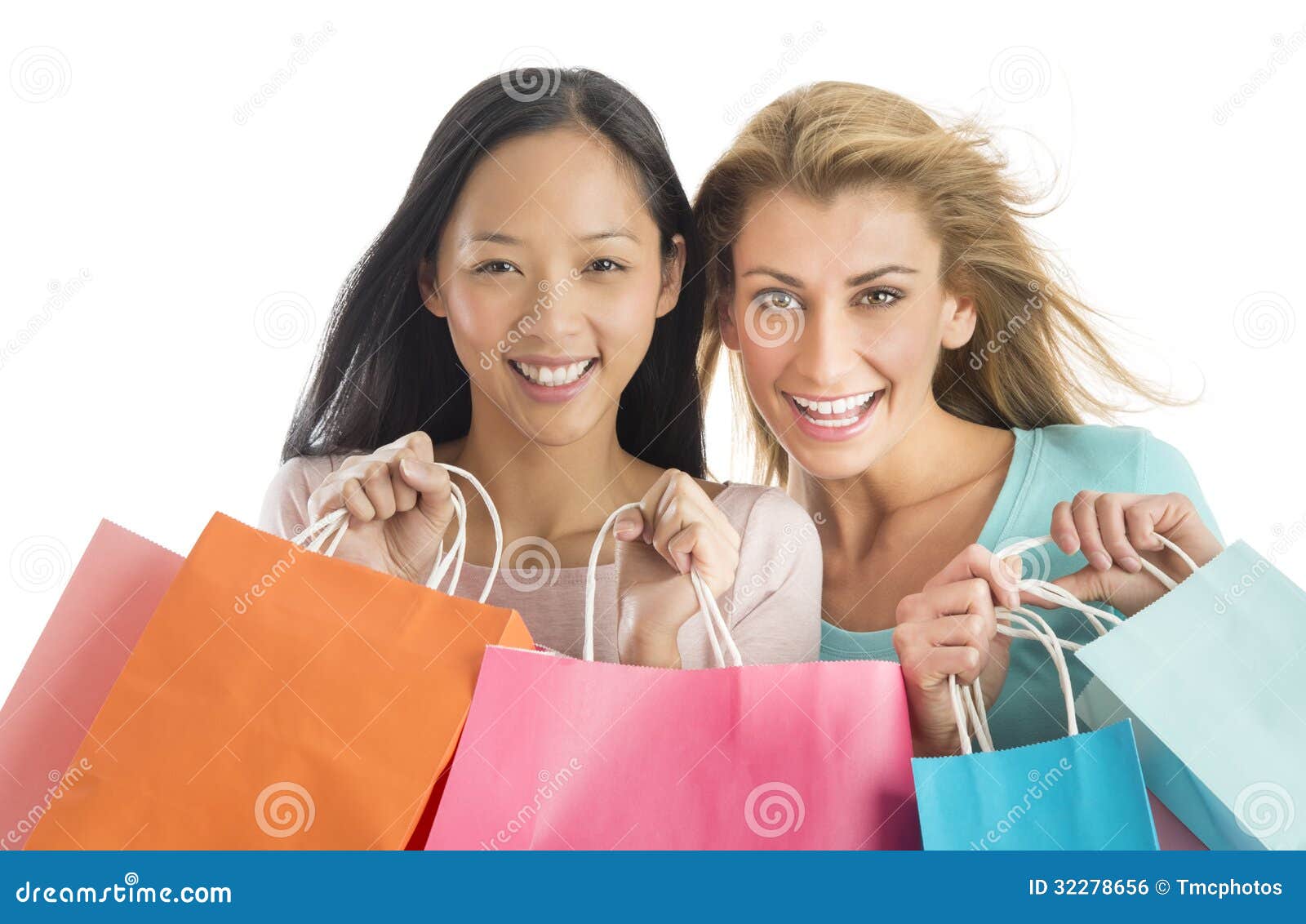 shopaholic female friends carrying shopping bags
